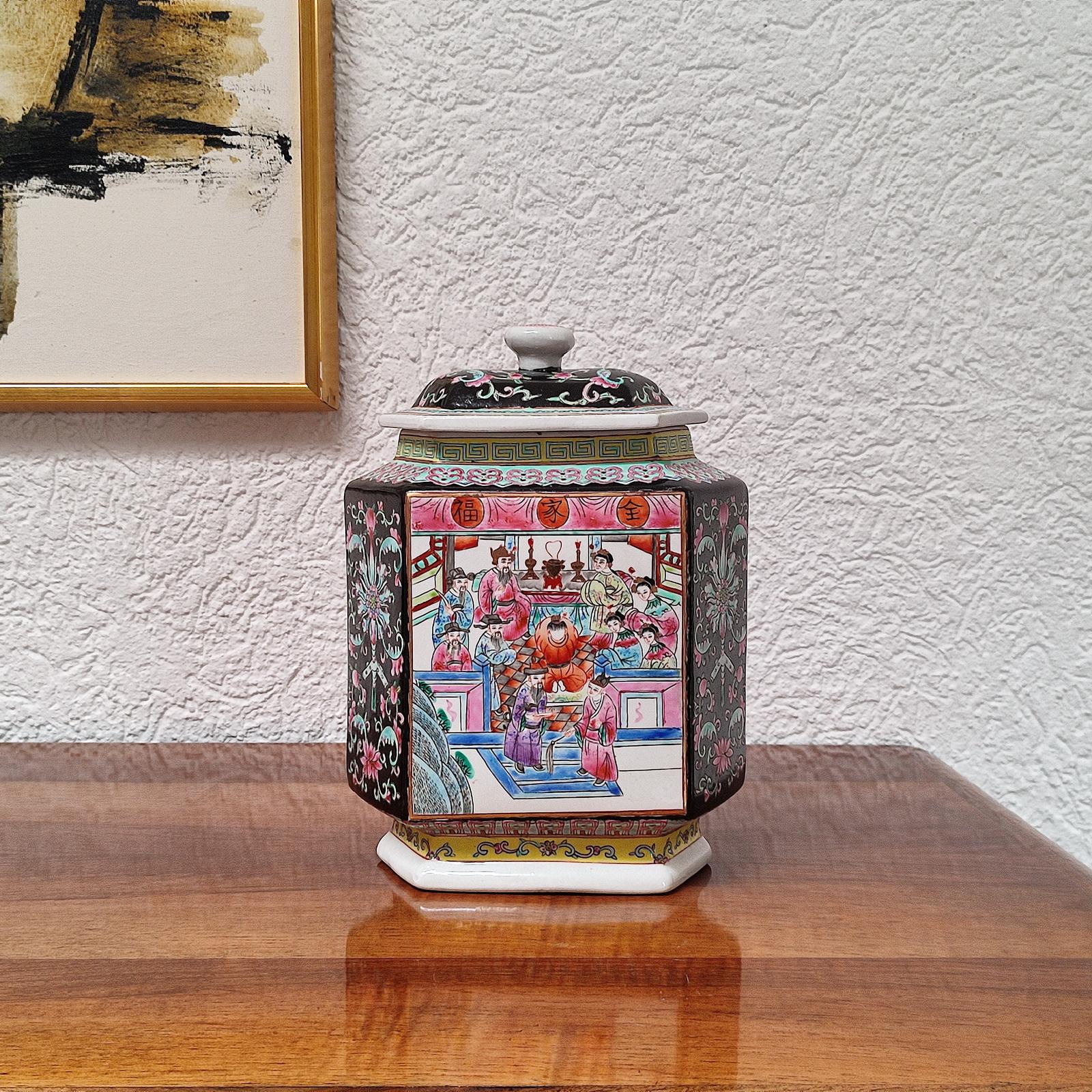 19th century Chinese porcelain jar with cover, richly hand painted with scenes of figures in procession on one side and figures gathered in family temple, sides with large peony blossoms and auspicious bats and peaches against a rich cobalt blue