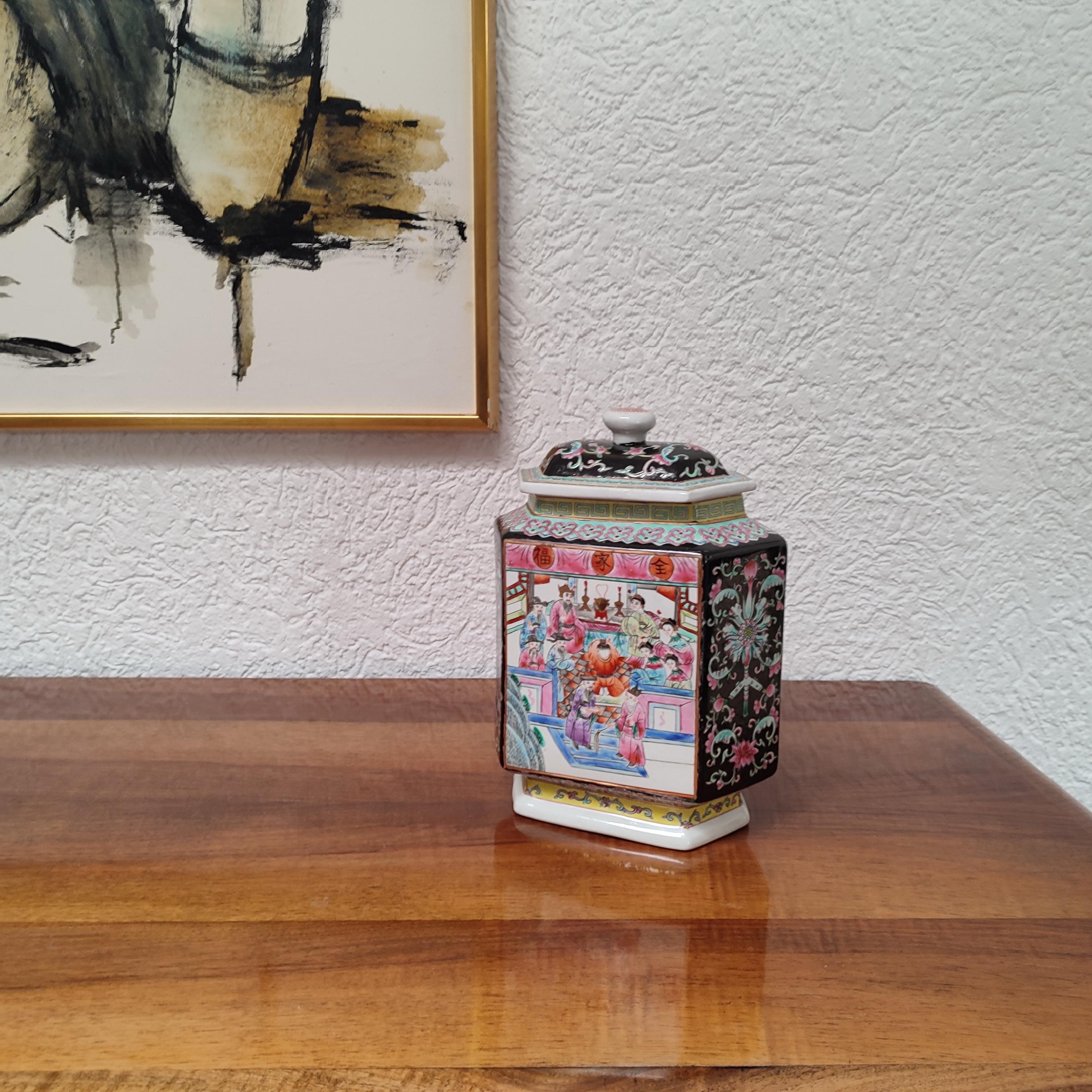 19th-century Chinese porcelain jar with cover, richly hand-painted with scenes of figures in procession on one side and figures gathered in family temple, sides with large peony blossoms and auspicious bats and peaches against a rich cobalt blue