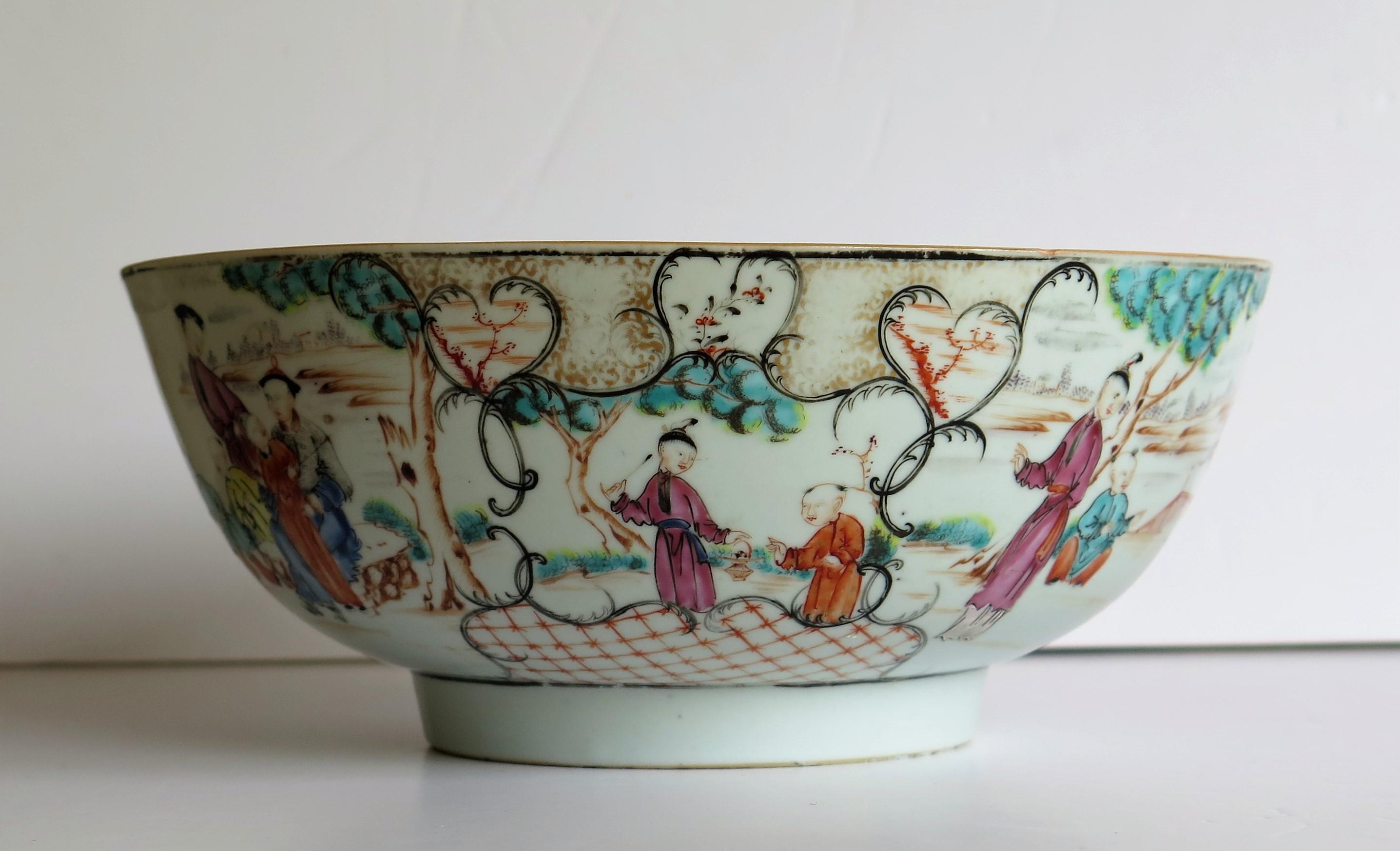 This is a finely hand painted Chinese export bowl from the 18th century, Qing dynasty, Qianlong period, 1736-1795. We date this piece to circa 1770.

It is beautifully hand decorated with different and continuous Chinese figure scenes in different
