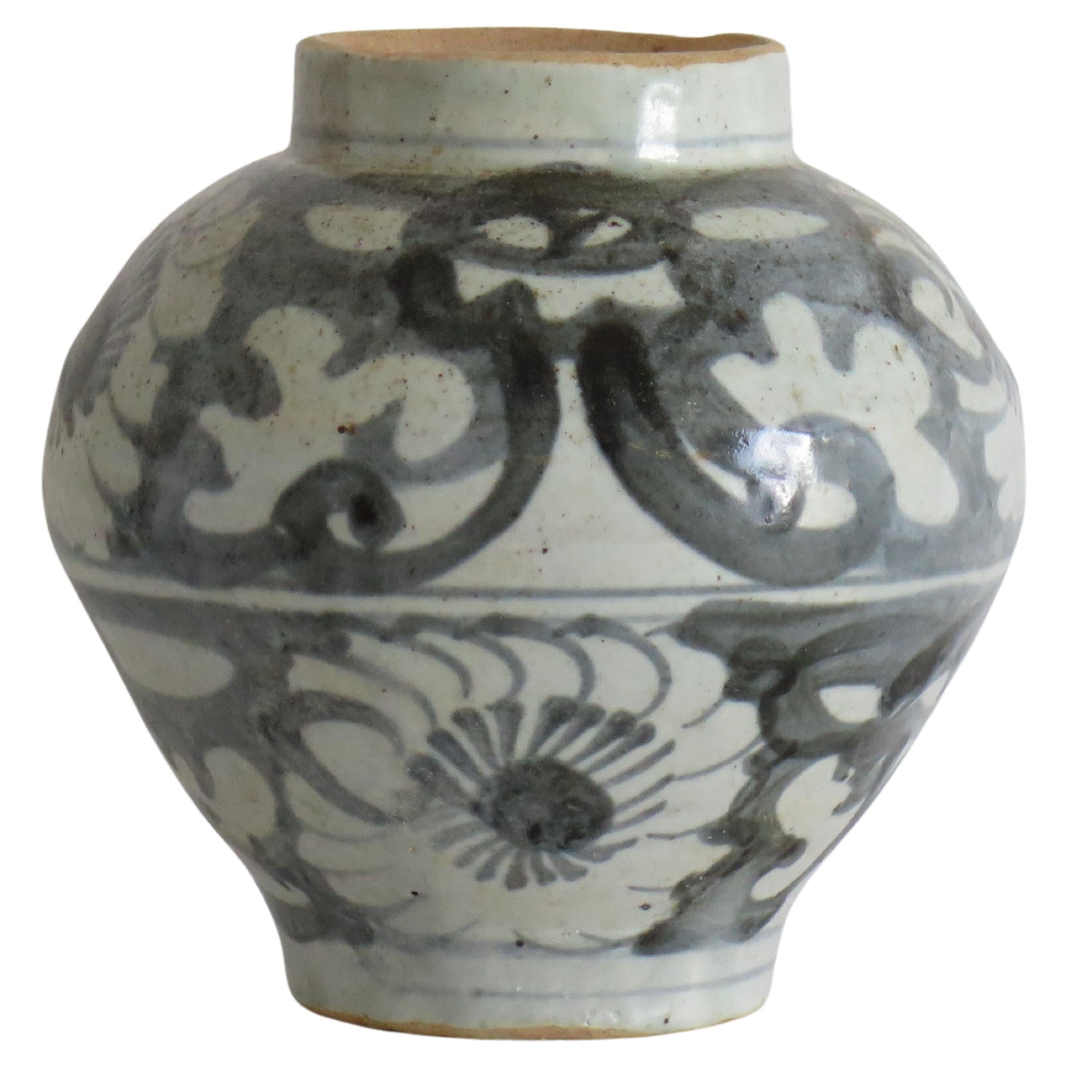 This is a Chinese handcrafted porcelain provincial jar or vase, all hand painted in cobalt blue and dating to the Ming period of the early 16th century or possibly earlier.

The jar is handcrafted, strongly potted with a baluster shape and short