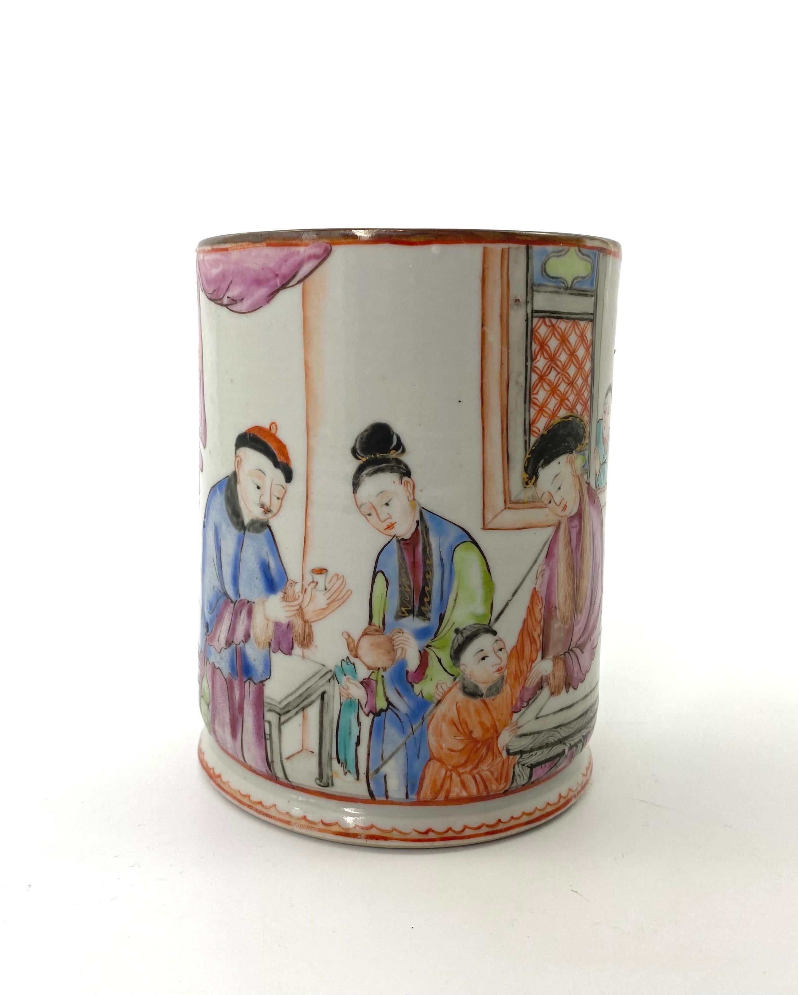 Chinese porcelain mug, c. 1760, Qianlong Period. Painted in famille rose enamels, with a scene of a family taking tea in an interior. The man holds a bird in his right hand, whilst his wife pours tea.
The simple loop handle surrounded by a scene of