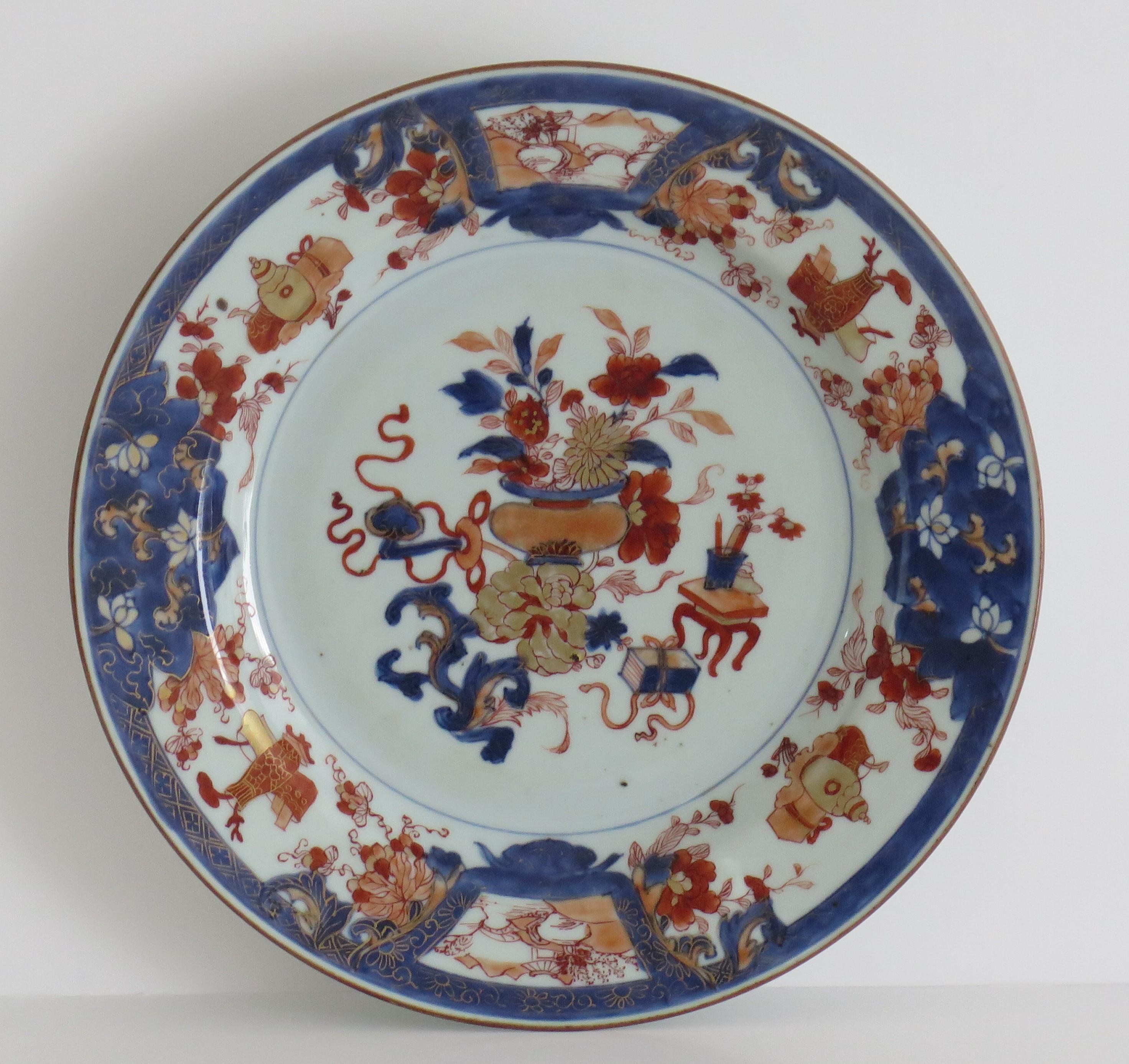This is a beautifully hand painted Chinese Export porcelain Plate from the Qing, Kangxi period, (1662-1722), circa 1700. 

The plate is of large dinner plate size with a 10 inch diameter. It is finely potted with a carefully cut base rim and a