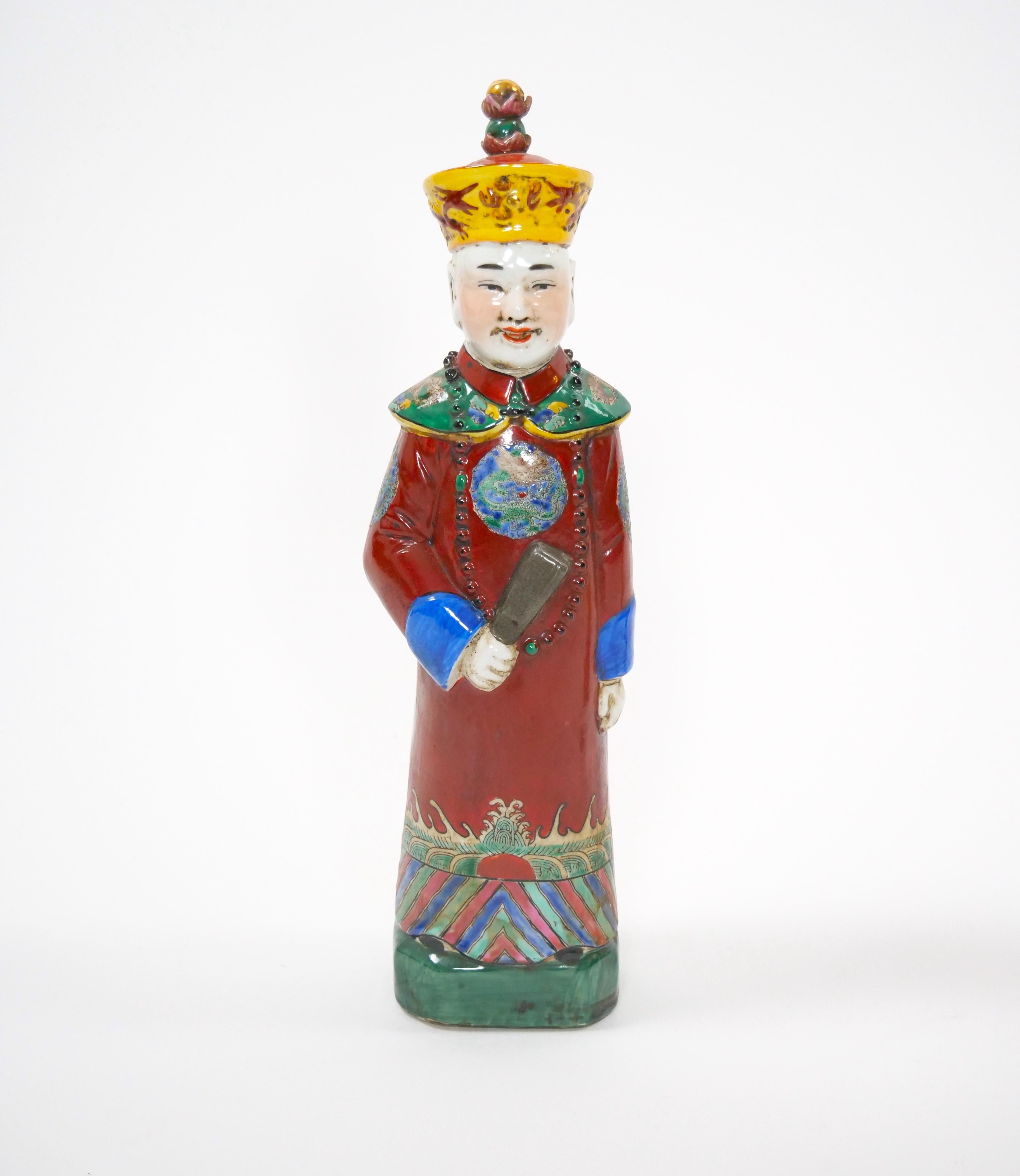 Elevate your collection with this exquisite Chinese porcelain figurine inspired by the illustrious Qing dynasty. Crafted in a stunning wucai style, the figurine depicts a distinguished emperor, regal royal, or a majestic monarch adorned in