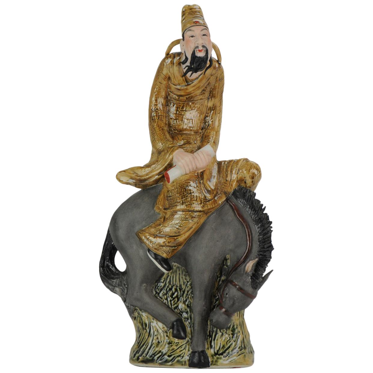 Chinese porcelain sculpture Man on Horse, Dated 1998, Created by Xu Jian Jian For Sale