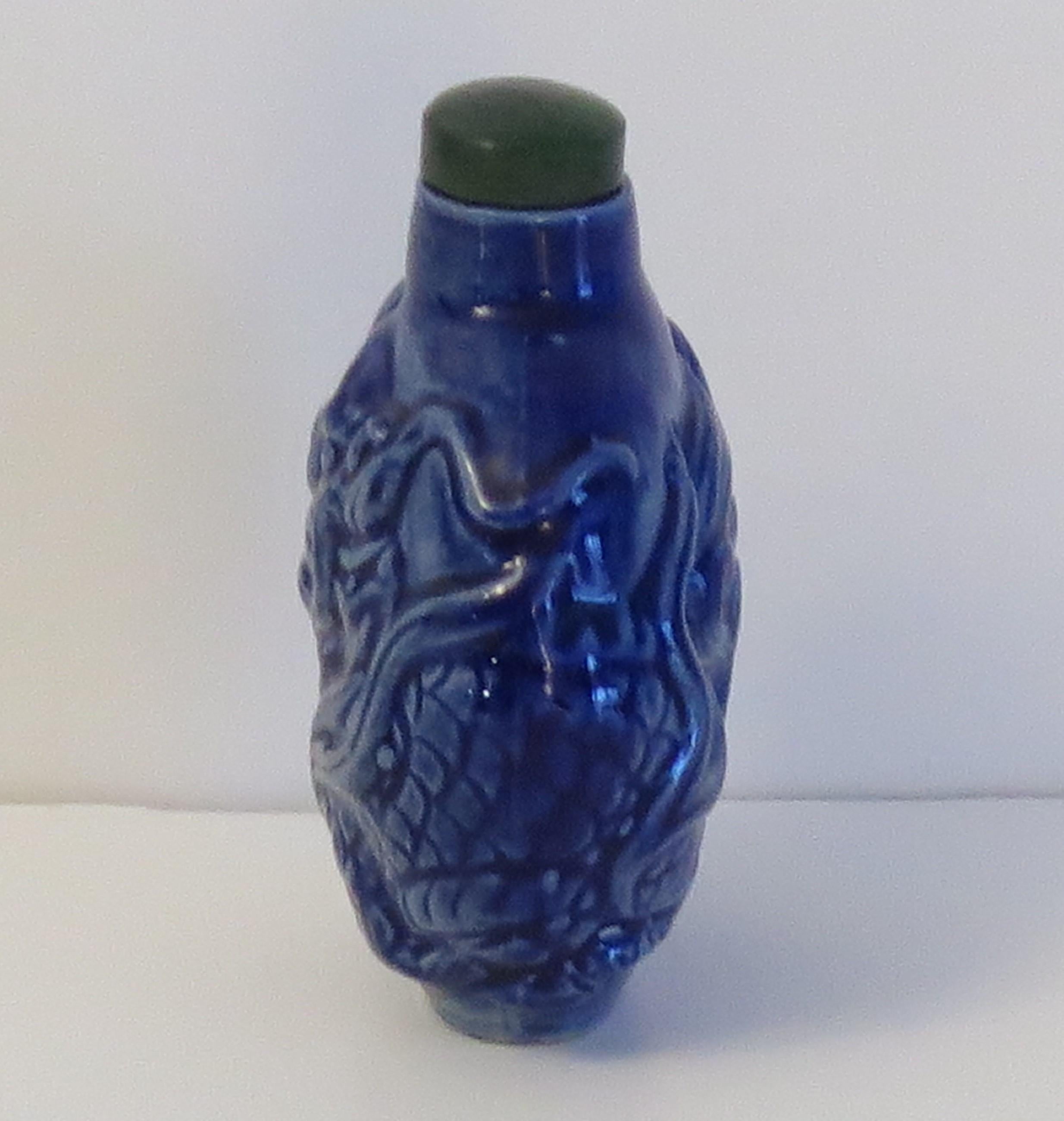 20th Century Chinese Porcelain Snuff Bottle moulded dragon stone top with spoon, Circa 1930s