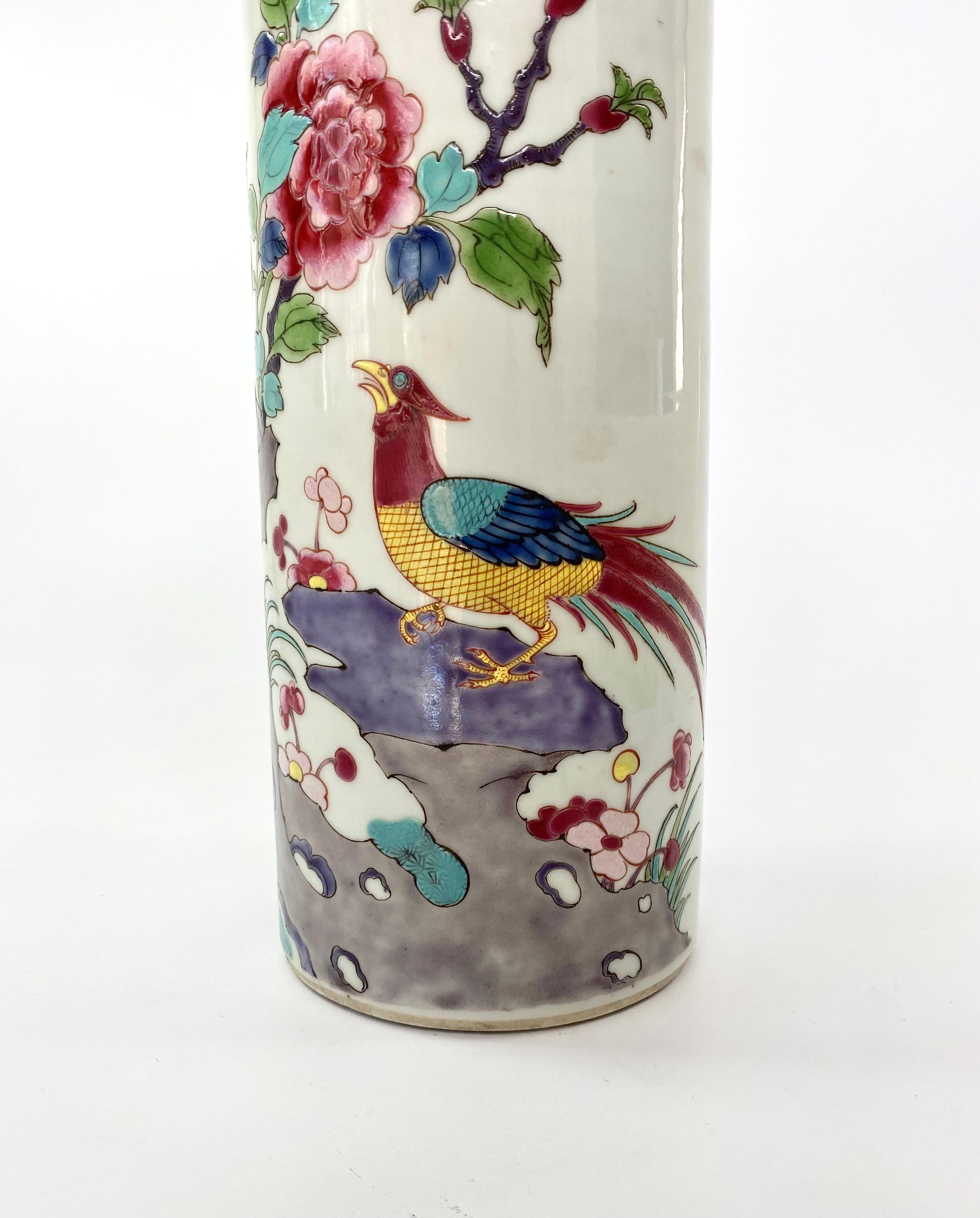 Chinese porcelain spill vase, c. 1890, Guangxu Period. The large, flared spill vase, vibrantly painted in Fencai or famille rose enamels, with a scene of exotic birds, perched upon rocks, beneath a flowering peony tree.
Medium: Porcelain
Measures: