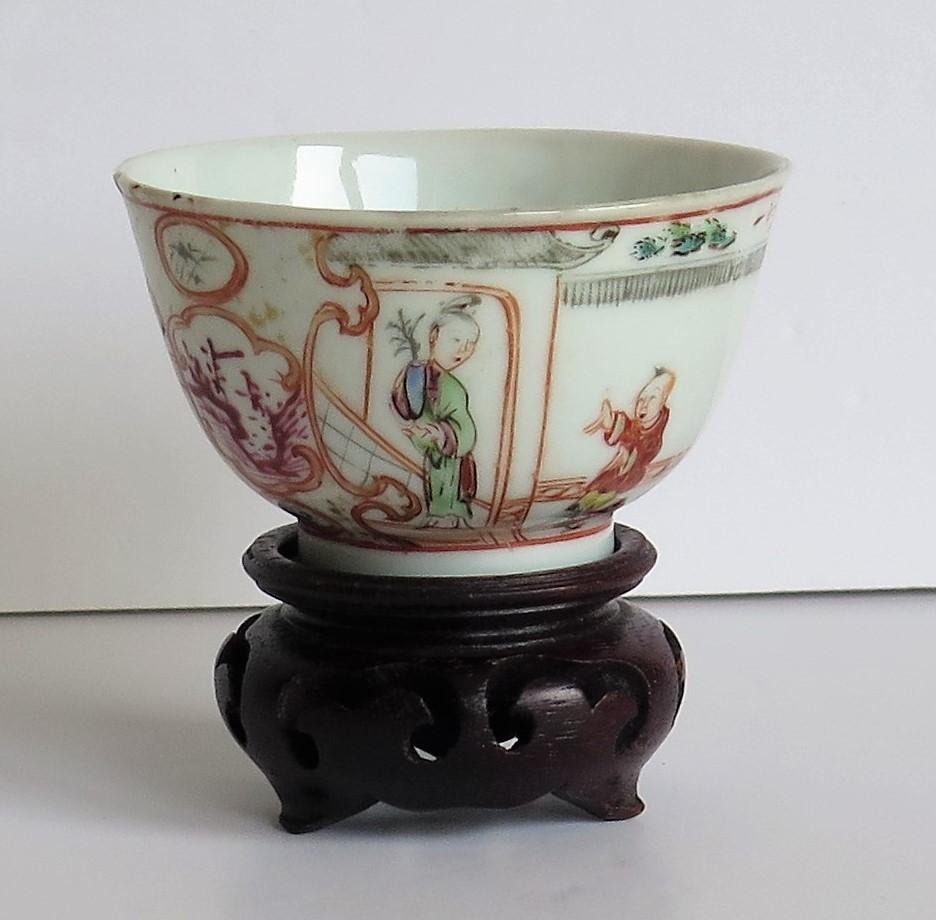 This is a very finely potted and hand painted Chinese porcelain tea bowl from the mid-18th century, Qing dynasty, early Qianlong period, 1736-1795. An old wood stand is also included free.

This is a very finely potted tea bowl of thin porcelain