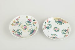 Chinese porcelain. Three small plates with famille rose decoration. 19th C.