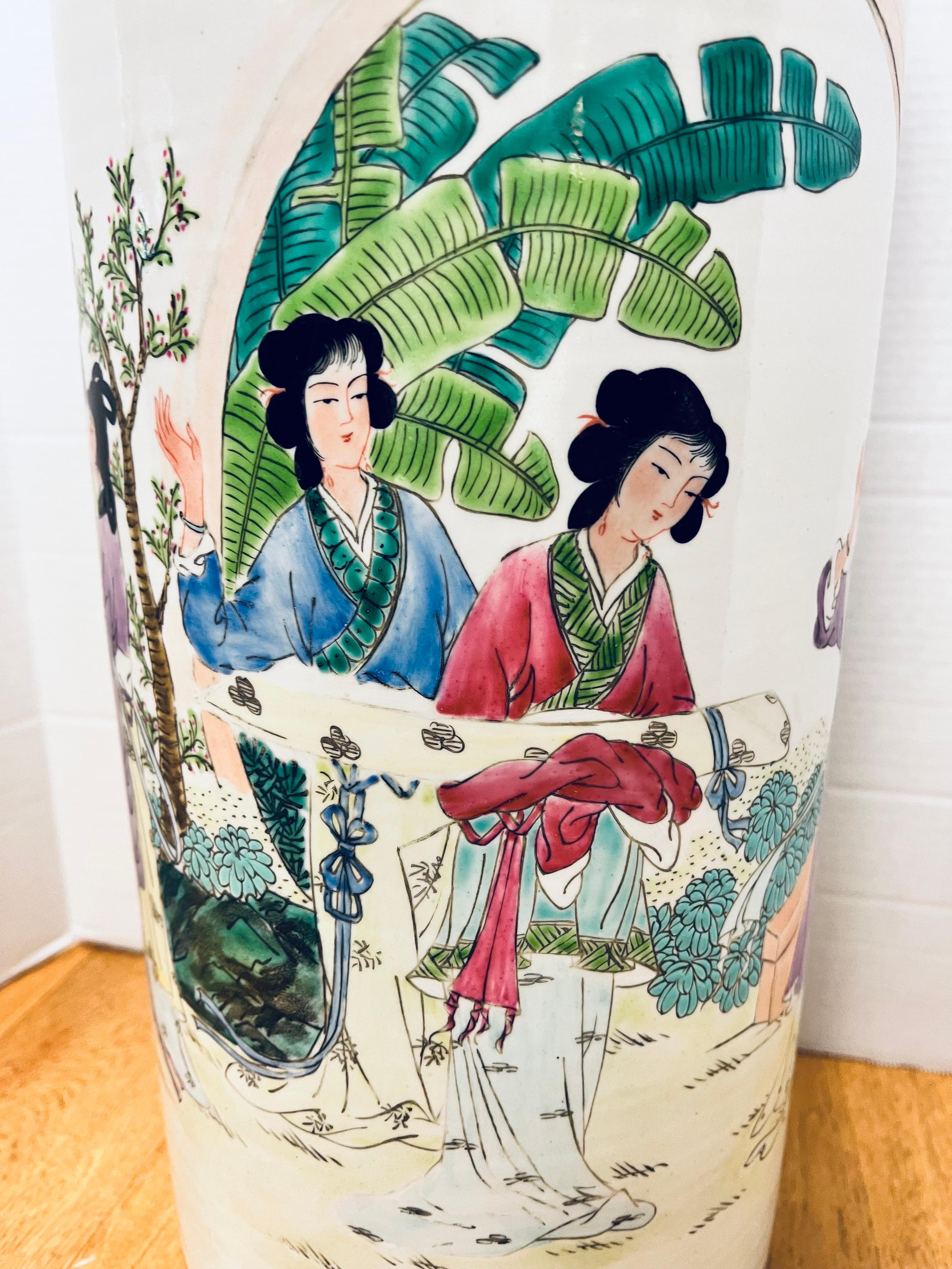 Stunning tall Chinese porcelain umbrella stand with colorful hand painted scenery all around. Signed with Chinese characters. No hallmarks present at bottom.