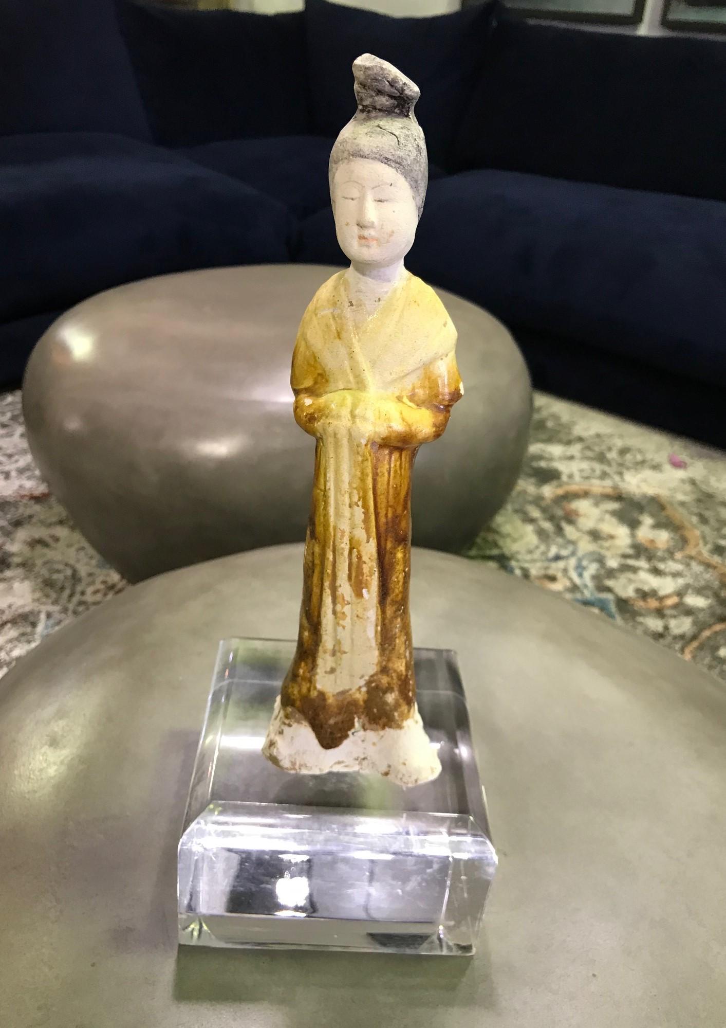 Simply gorgeous and so delicately and beautifully made. This work has been molded in a whitish, dense terra cotta, typical of the region of the capital of Luoyang, and then attractively glazed over with various yellow, green, brown, amber, colored