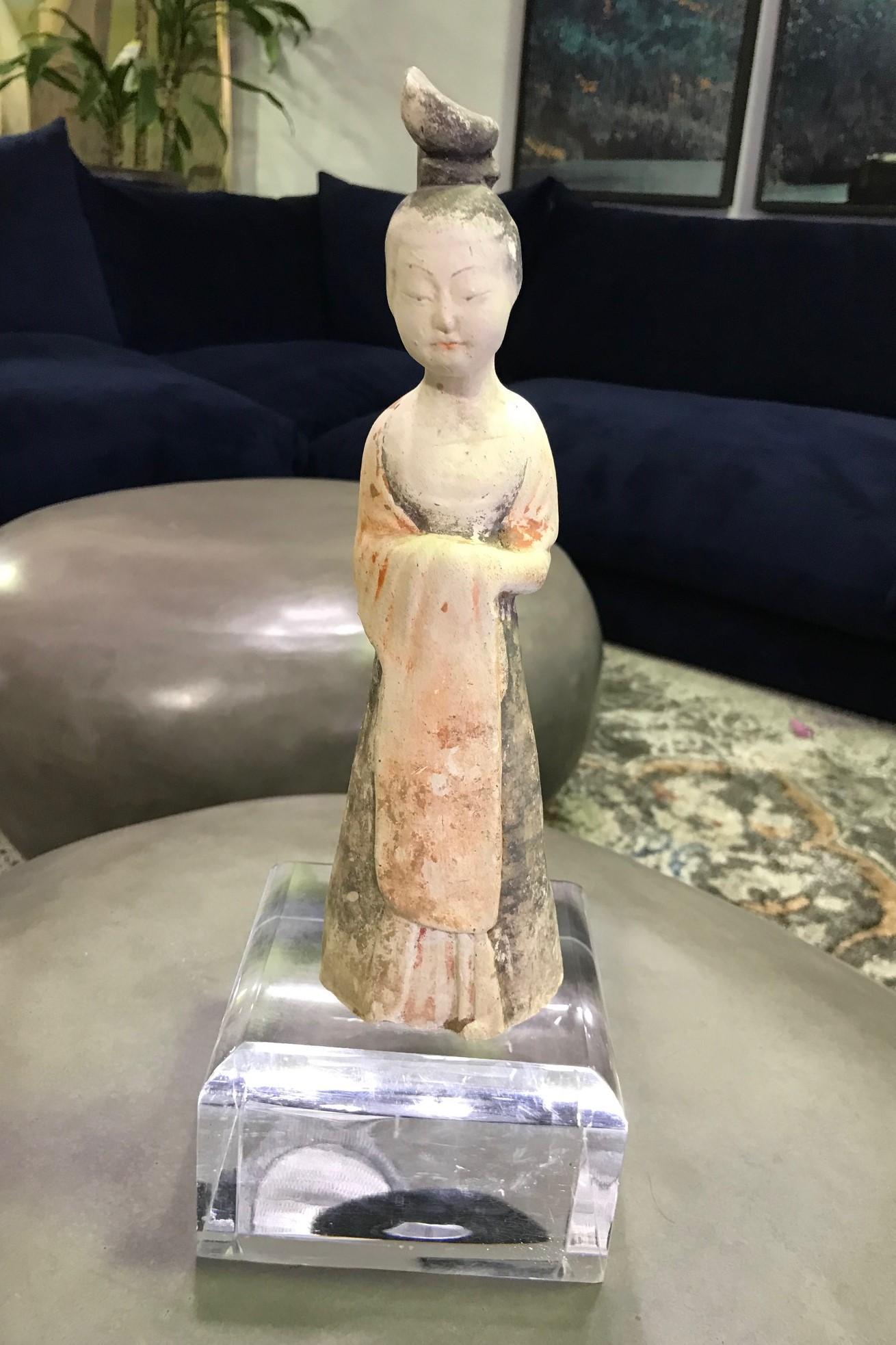 Simply gorgeous and so delicately and beautifully made. This work has been molded in a whitish, dense terracotta, typical of the region of the capital of Luoyang, and then lightly glazed.

We are not sure how to date this work. We believe, based