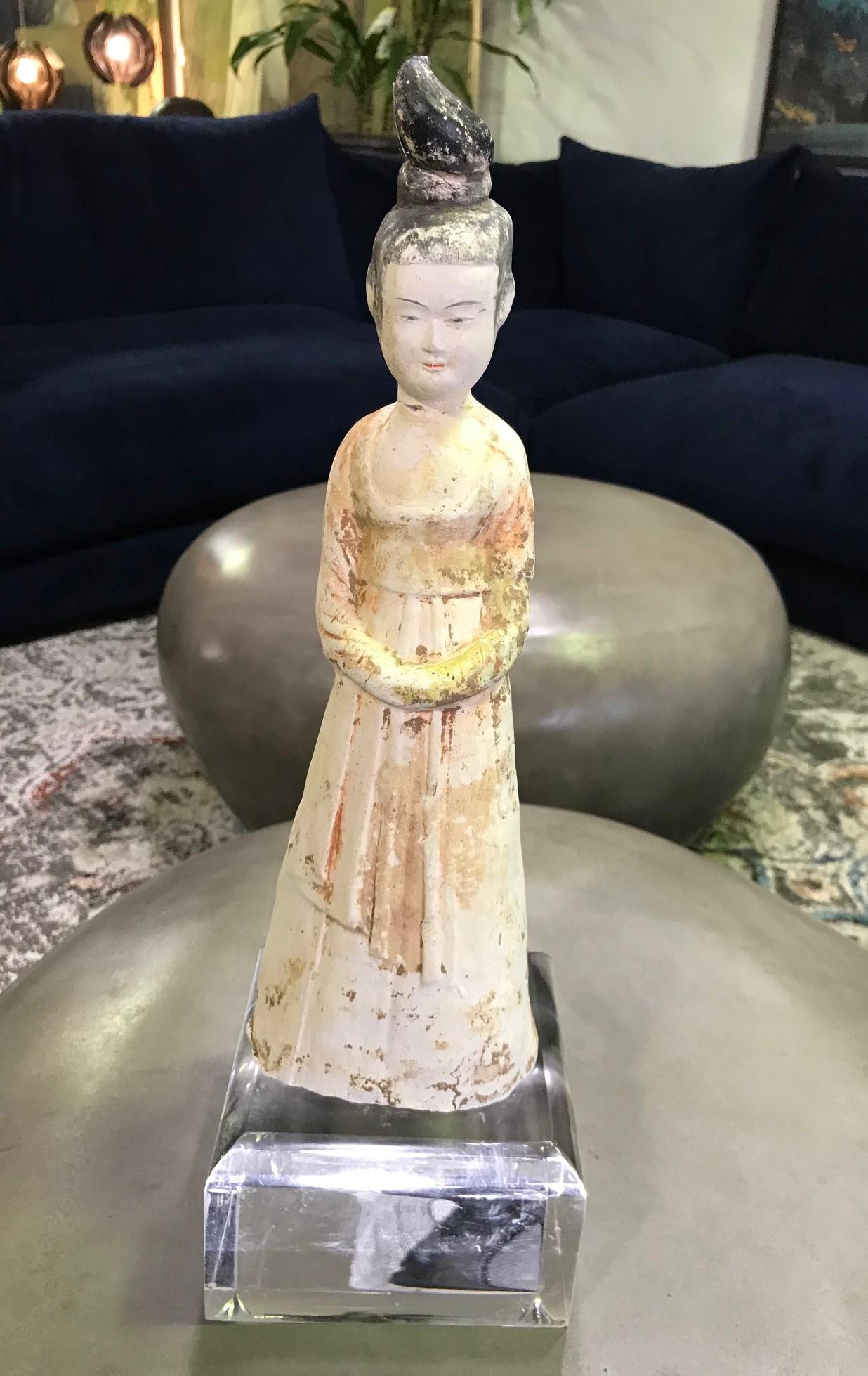 Simply gorgeous and so delicately and beautifully made. This work has been molded in a whitish, dense terracotta, typical of the region of the capital of Luoyang, and then lightly glazed.

We are not sure how to date this work. We believe, based