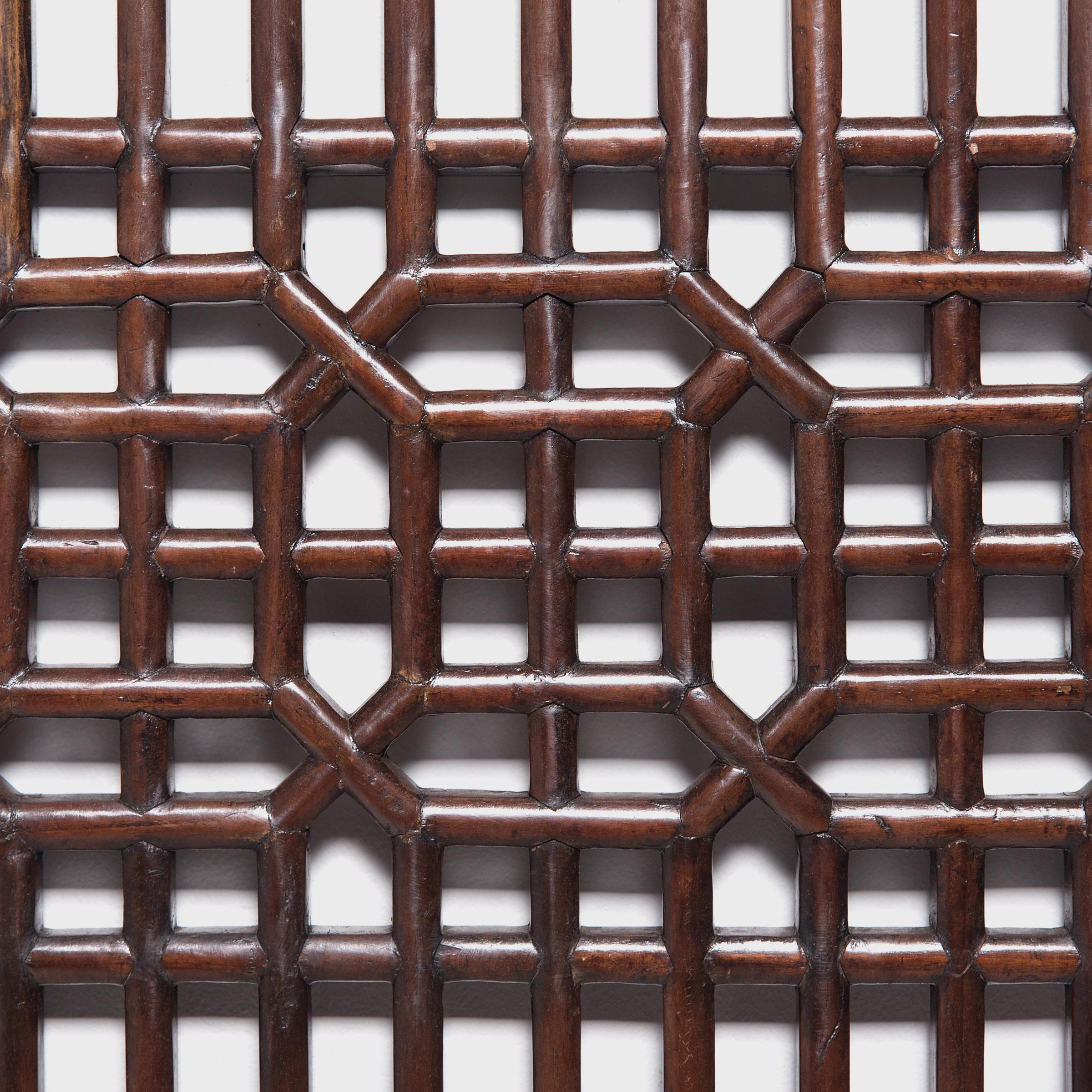 Dated to the early 19th century, this lattice panel was originally a window insert to a set of tall paneled courtyard doors. The geometric lattice pattern is linear and open, and was designed to allow light and fresh air to flow into a room while