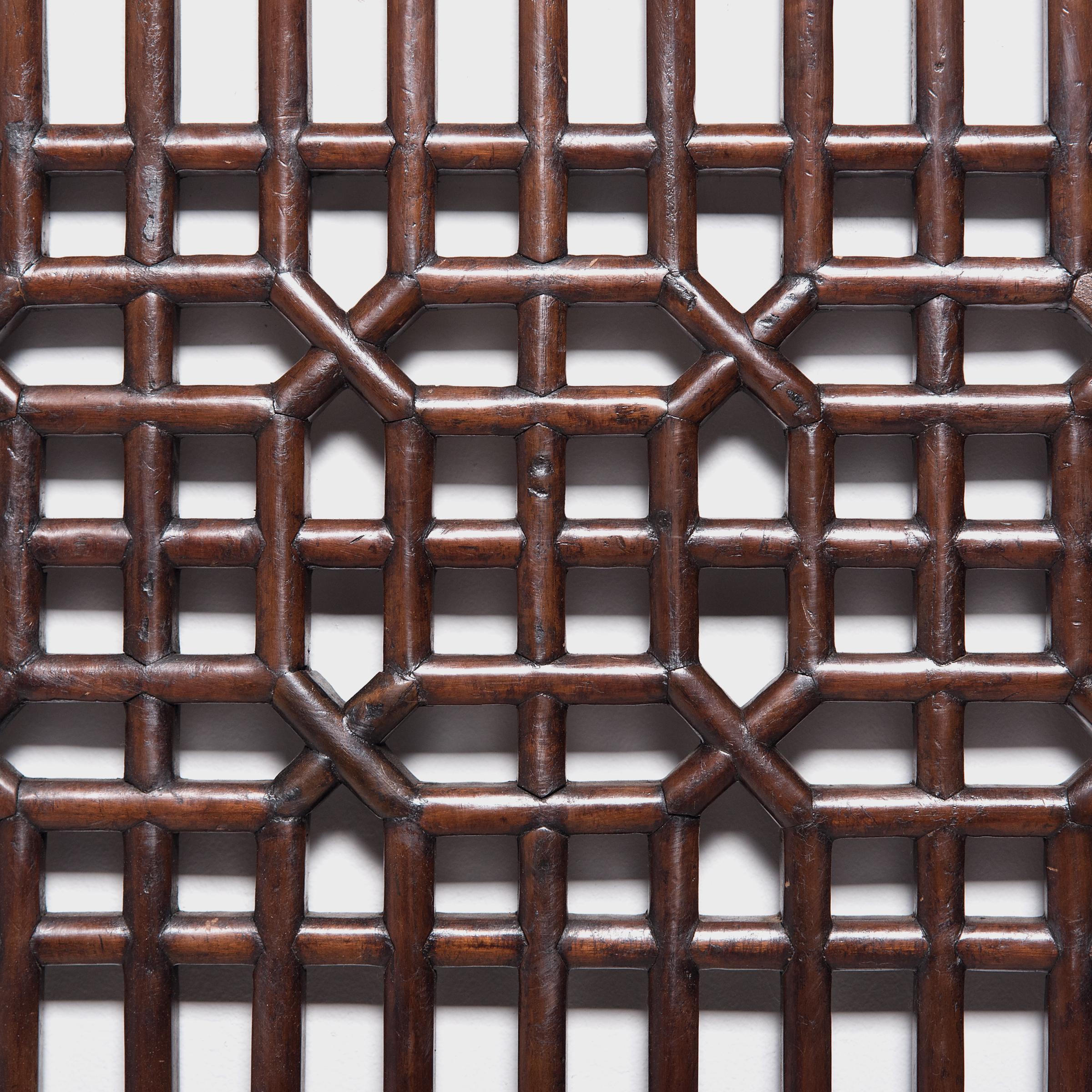 Dated to the early 19th century, this lattice panel was originally a window insert to a set of tall paneled courtyard doors. The geometric lattice pattern is linear and open, and was designed to allow light and fresh air to flow into a room while