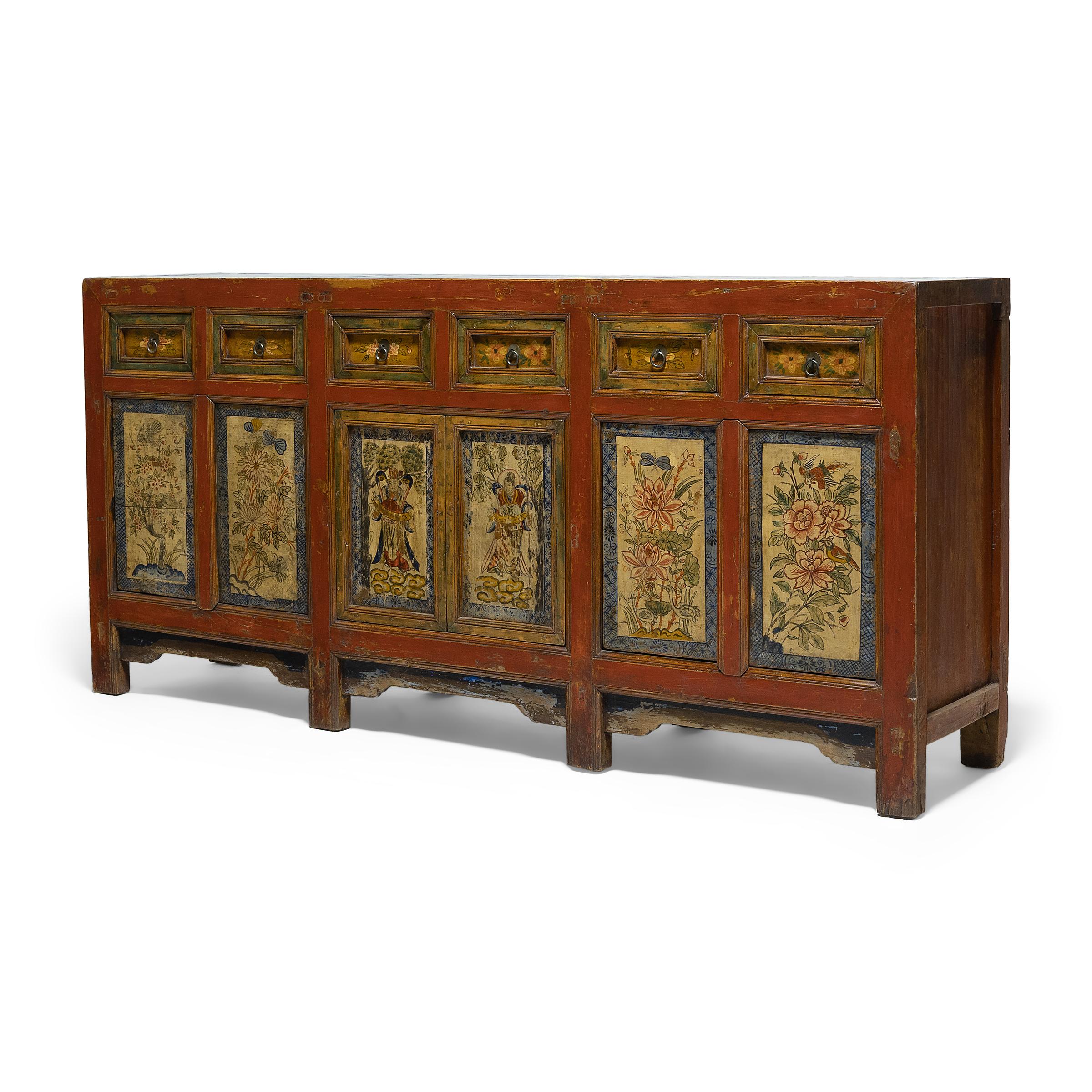 This provincial coffer from northern China has a simple, clean-lined form embellished with colorful lacquer and hand-painted decoration. The cabinet was crafted in the late 19th century with mortise-and-tenon joinery methods, without the use of
