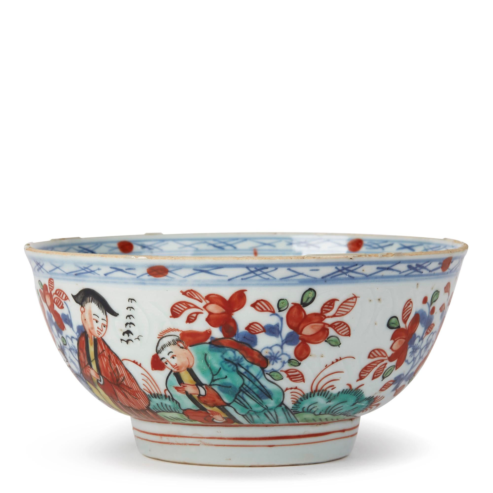 A rare and unusual antique Chinese Qianlong, or earlier, porcelain bowl, probably Dutch decorated with a figure in a red gown with two attendants surrounded by underglaze blue and enameled floral sprigs against an anhua ground, the inner bowl with