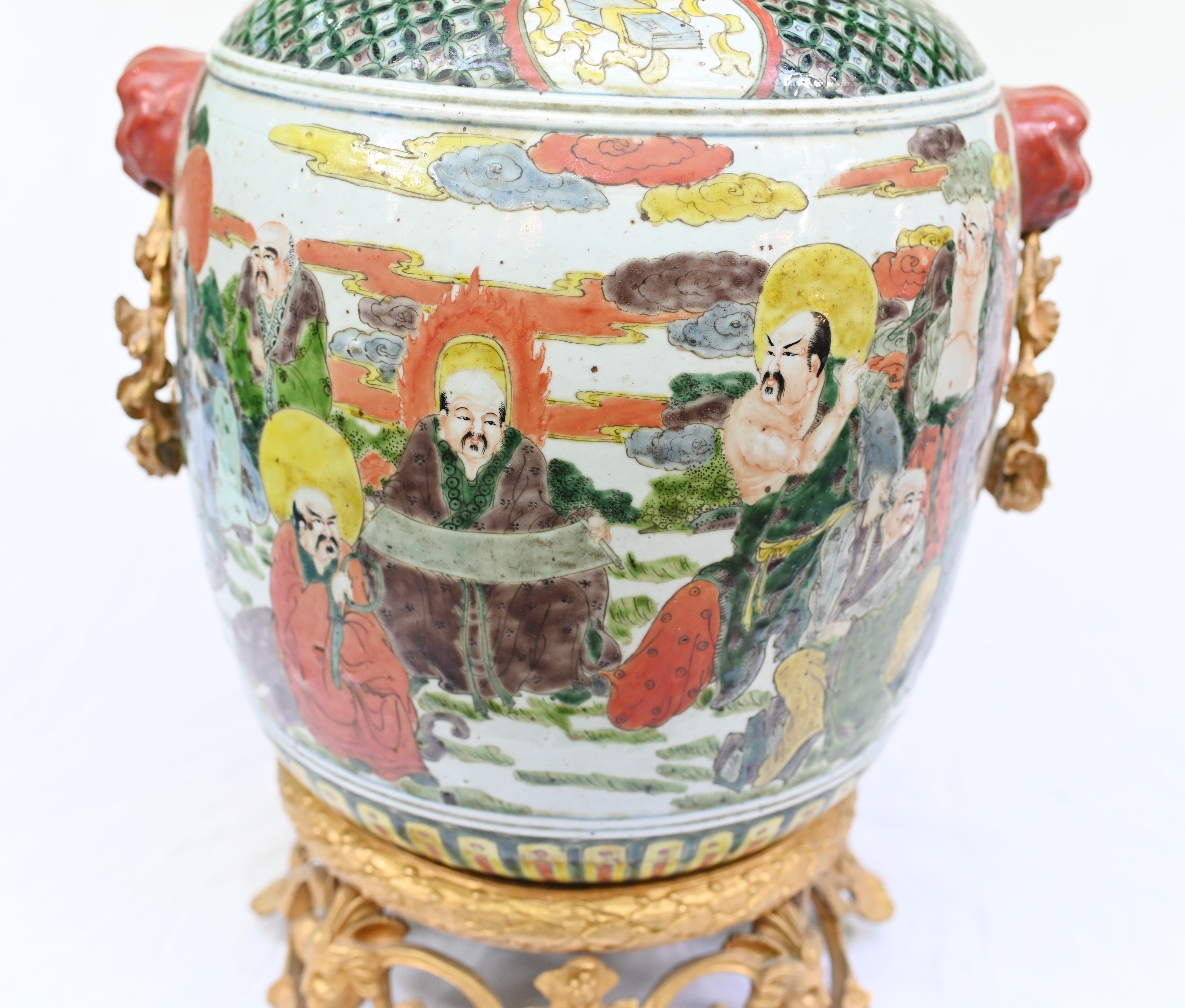 Characterful Chinese antique Qianlong urn with French gilt mounts
Porcelain features distinctive hand painted designs including
Chinese figures and motifs
We date this to circa 1910
It was common for these vases to be adapted for the French