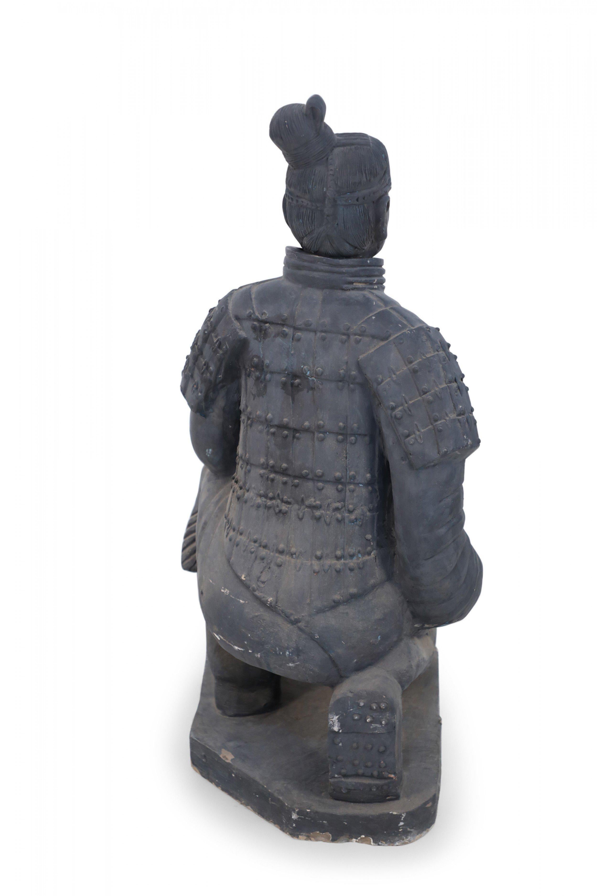 Chinese Qin Dynasty-style (20th Century) life-size terracotta soldier statue kneeling on a rectangular base. (Head is removable)(Companion piece: NWL2500)