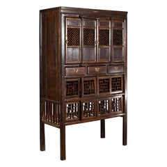 Chinese Qing 19th Century Brown Cabinet with Fretwork Doors and Three Drawers