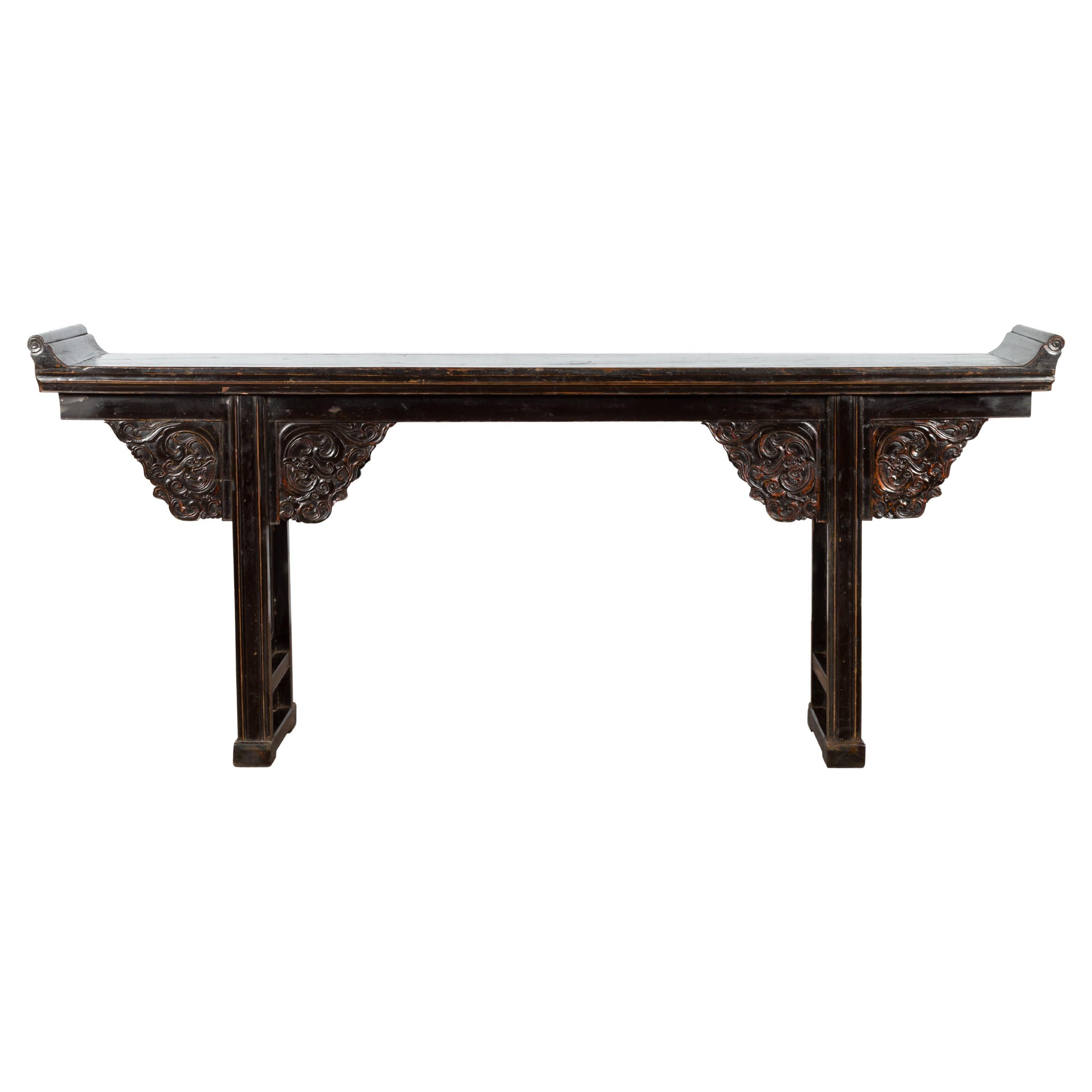 Chinese Qing Dynasty 19th Century Black Console Table with Carved Dragon Motifs For Sale