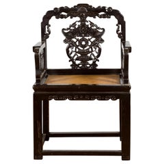 Antique Chinese Qing Dynasty 19th Century Black Lacquered Hand Carved Chair with Rattan