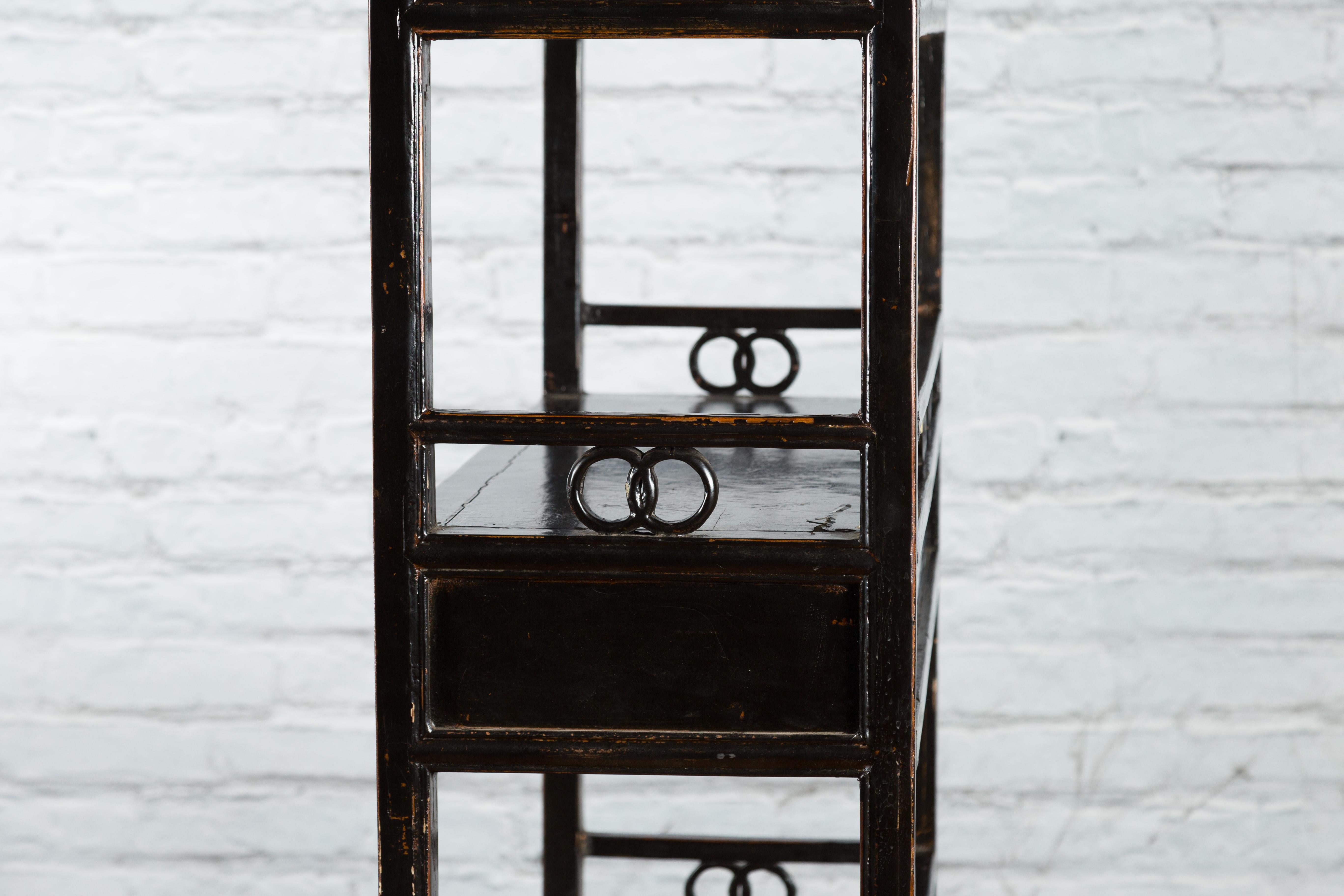 Carved Chinese Qing Dynasty 19th Century Bookcase with Open Shelves and Ring Motifs