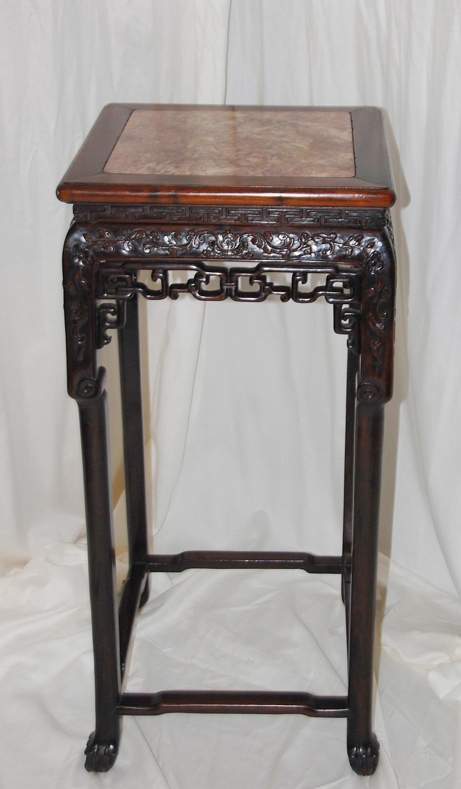 Chinese Qing dynasty 19th century carved hardwood stand with rose marble inset to the top. This subtly carved 35 1/2 inch tall stand makes an excellent display pedestal for all kinds of special objects, or planters, or elegant flower arrangements or