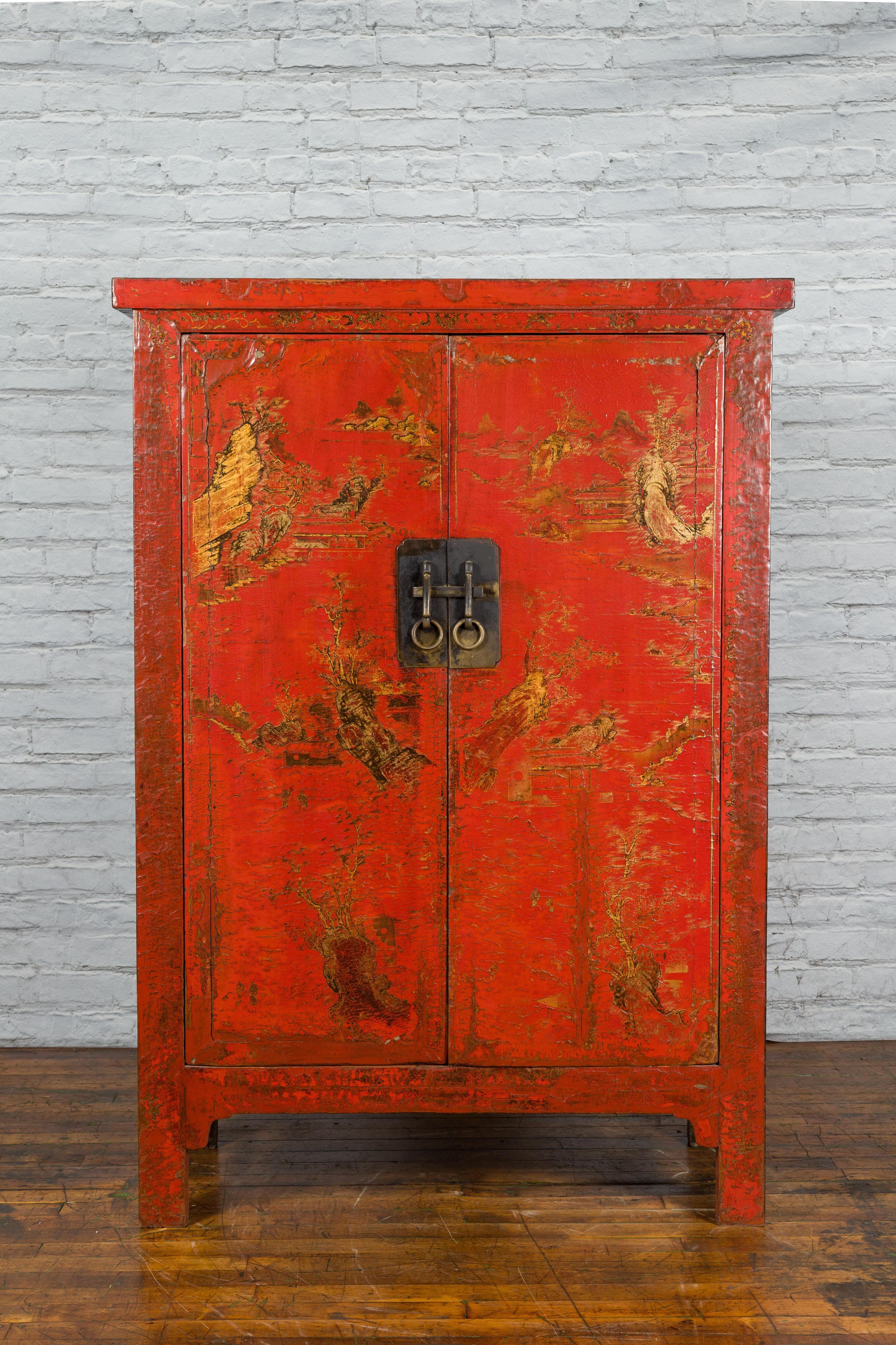 A Chinese Qing Dynasty period Shanxi cabinet from the 19th century with original red lacquer and hand-painted décor. Created in the North-Eastern province of Shanxi during the Qing dynasty, this 19th century cabinet features its original red lacquer