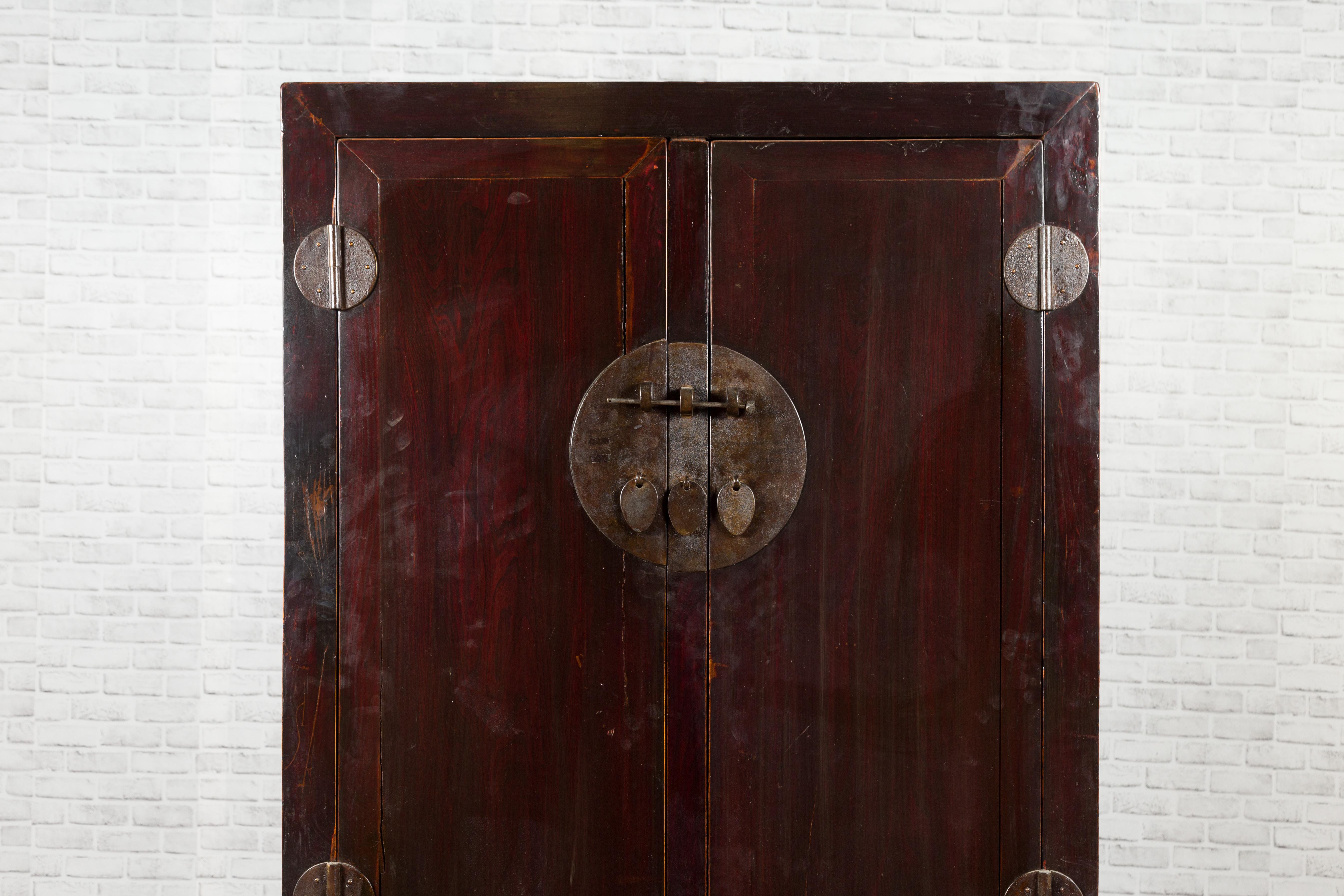 Wood Chinese Qing Dynasty 19th Century Dark Brown Lacquer Cabinet with Carved Foliage For Sale