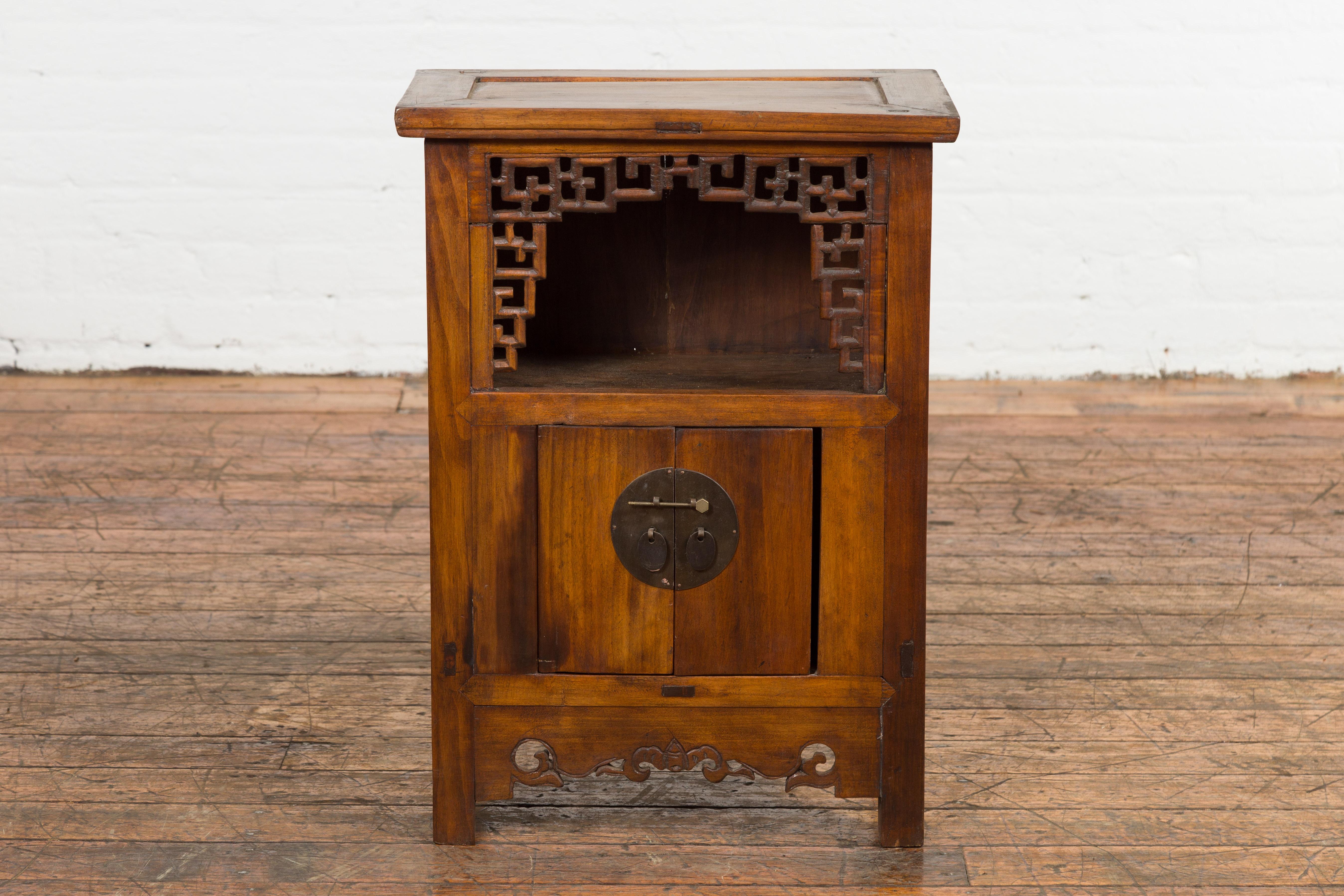 Carved Chinese Qing Dynasty 19th Century Elm Side Cabinet with Fretwork Shelf and Doors For Sale