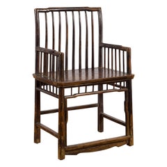 Chinese Qing Dynasty 19th Century Elmwood Armchair with Slatted Back and Arms
