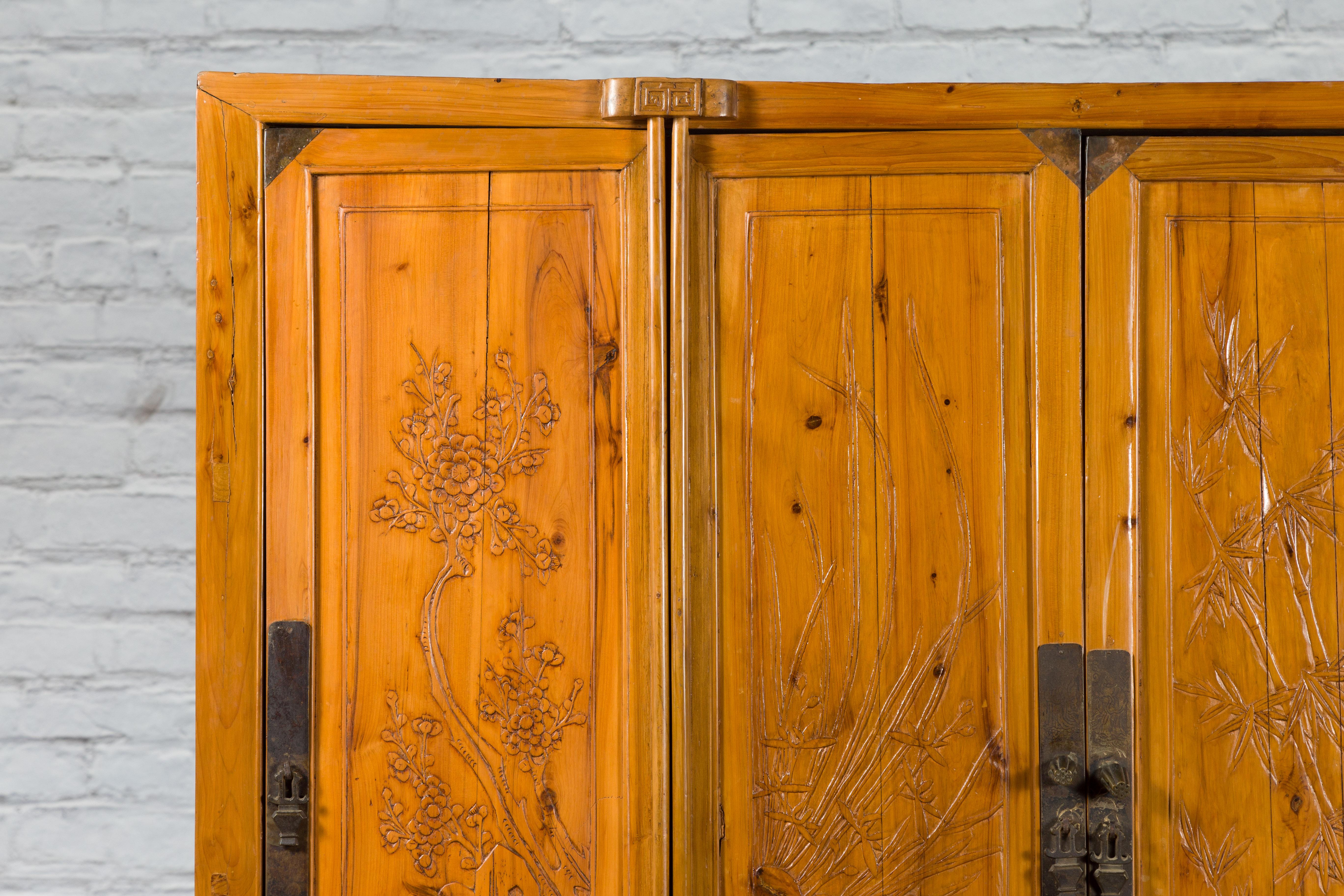 Large Chinese Elmwood Four-Door Armoire with Low-Relief Carved Foliage For Sale 1