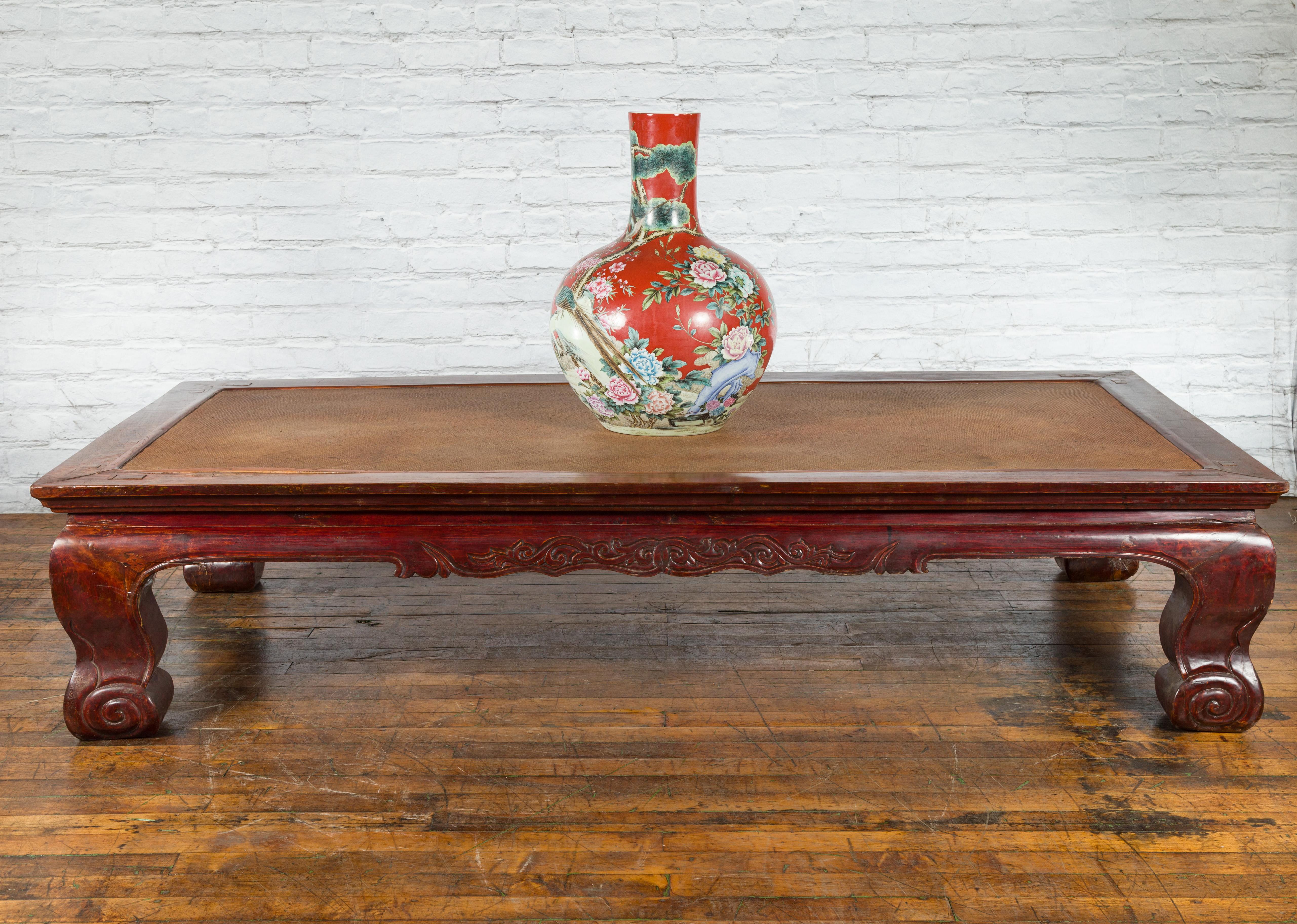 Carved Chinese Qing Dynasty 19th Century Mahogany Stained Coffee Table with Rattan Top For Sale