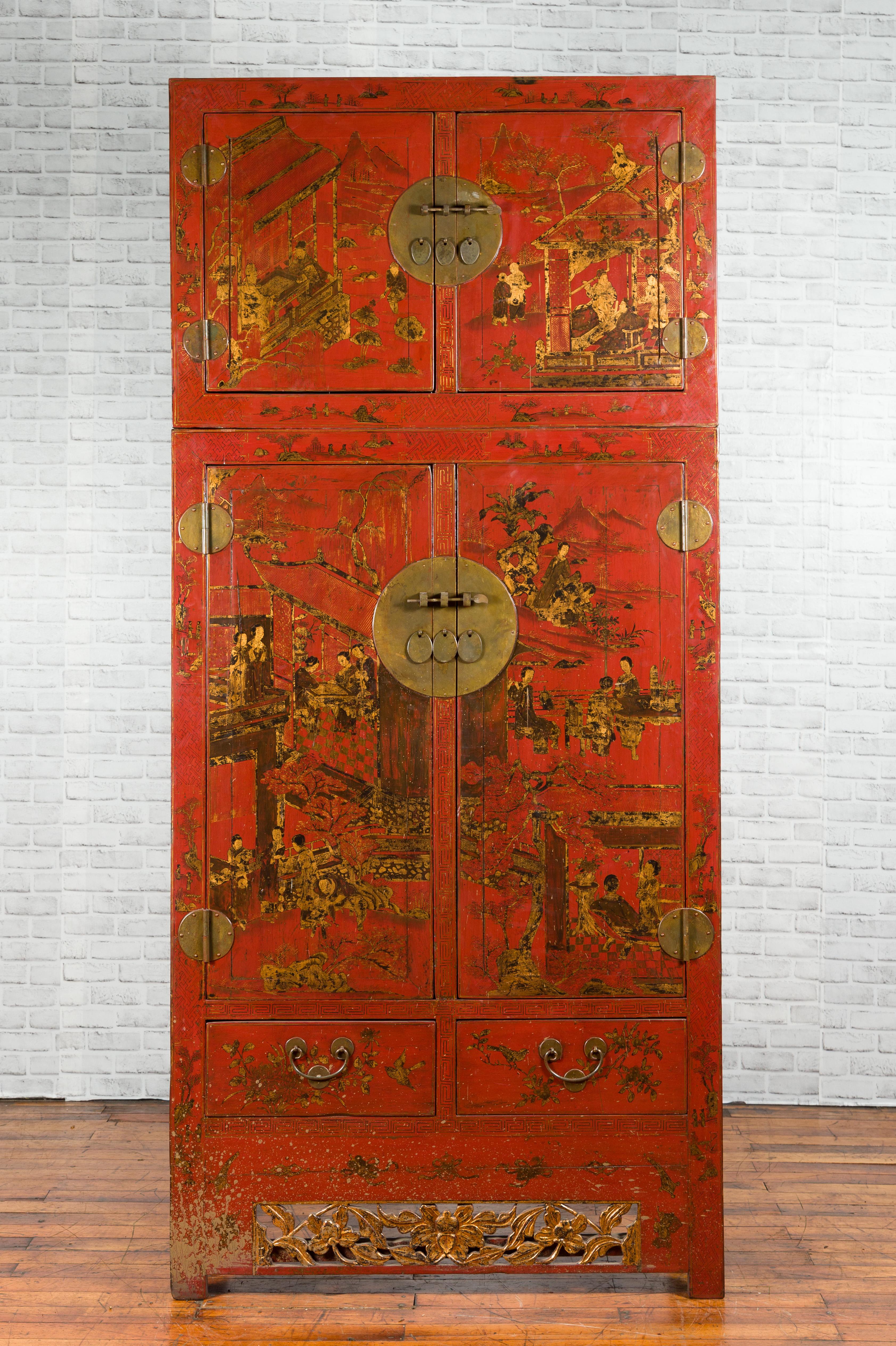 A Chinese Qing dynasty period red lacquer compound cabinet from the 19th century, with gilded Chinoiserie décor, drawers and carved apron. Created in China during the Qing dynasty, this compound cabinet features a smaller storage chest stacked on