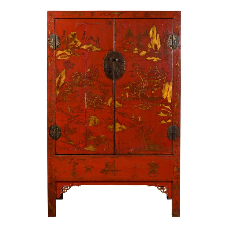 A Chinese Qing Dynasty period original red lacquer cabinet from the 19th century, with gilt Chinoiserie décor. Created in China during the Qing Dynasty, this cabinet features a linear silhouette perfectly accented by a red lacquered ground