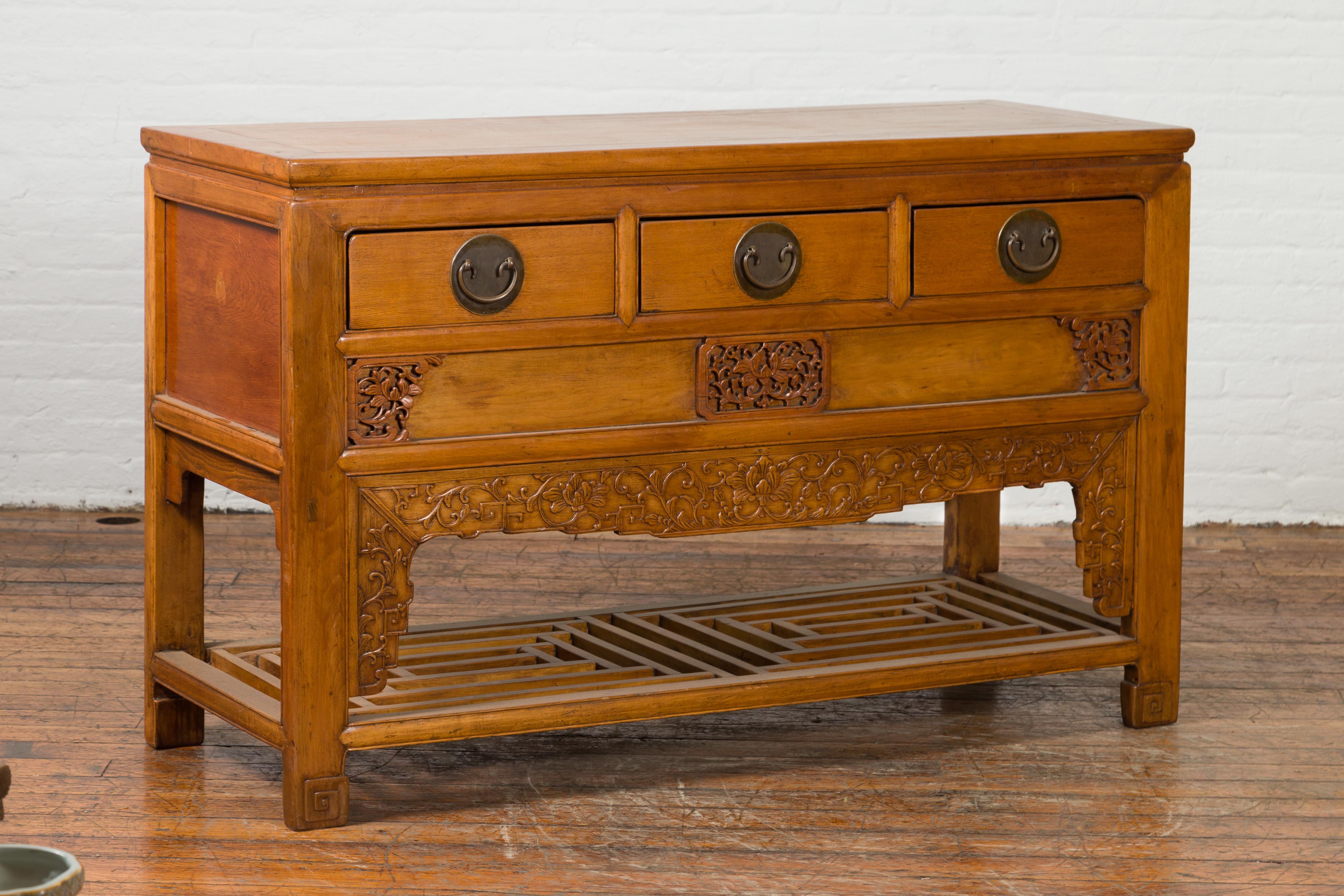 Wood Chinese Qing Dynasty 19th Century Waisted Sideboard with Carved Floral Motifs For Sale