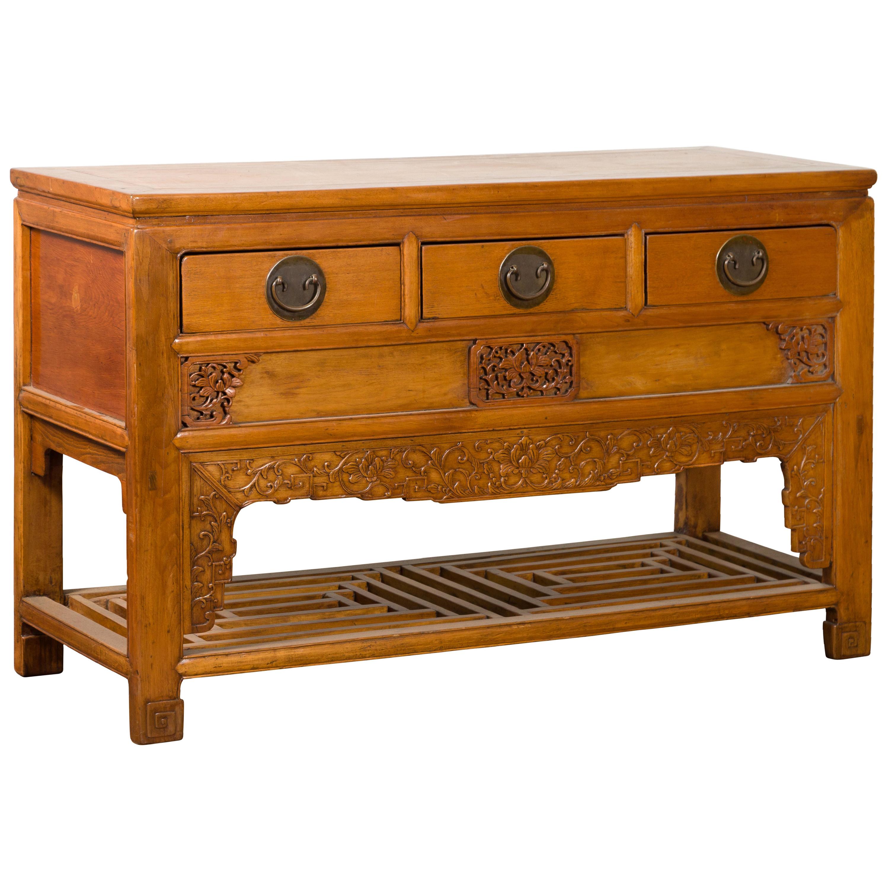Chinese Qing Dynasty 19th Century Waisted Sideboard with Carved Floral Motifs For Sale