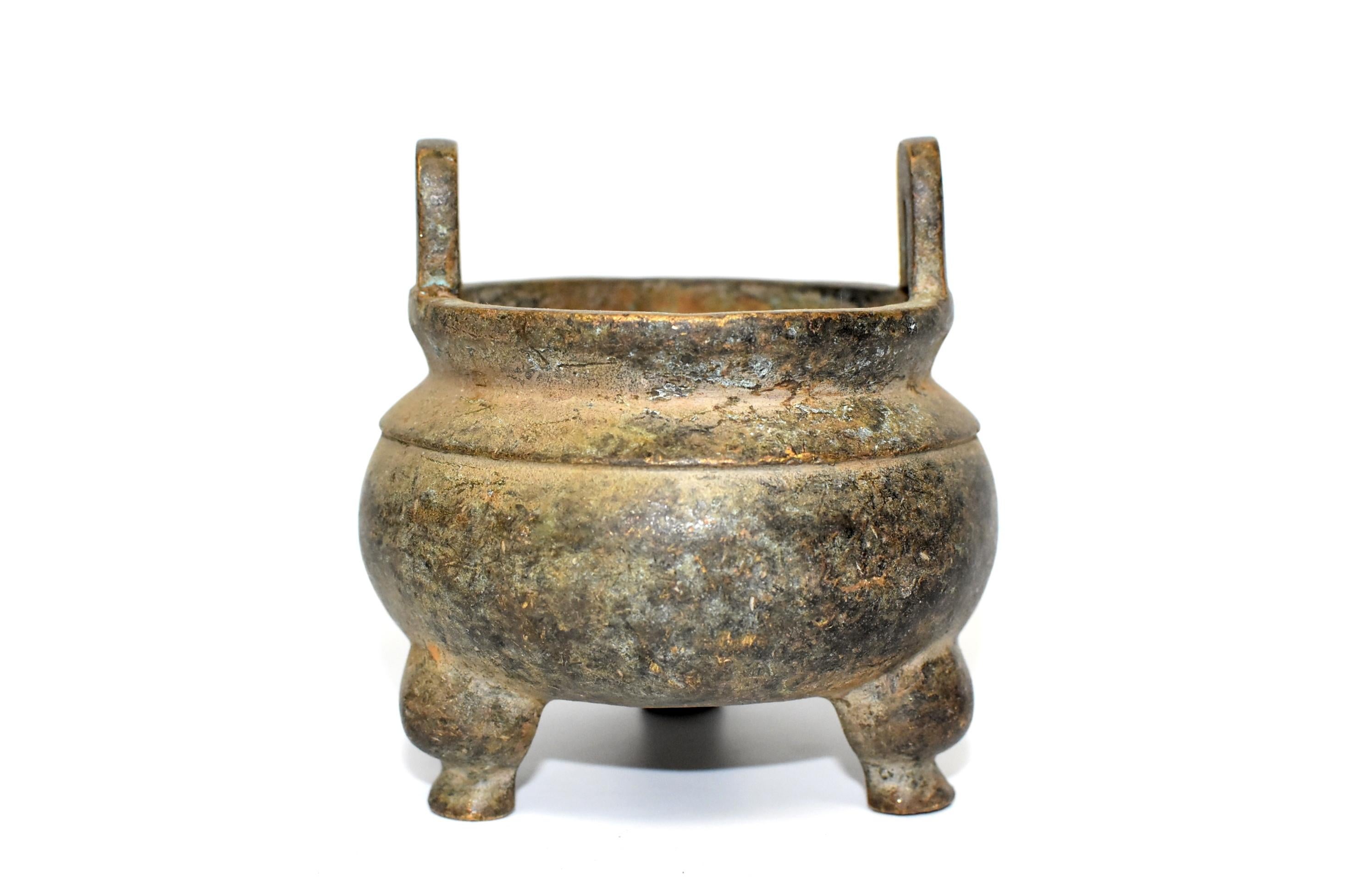 This rare collection consists of 3 antique bronze incense burners. Two of them are of a traditional bulbous shape. One of them has the form of a pomegranate. These small burners are substantial in weight, and finely made with great attentions paid