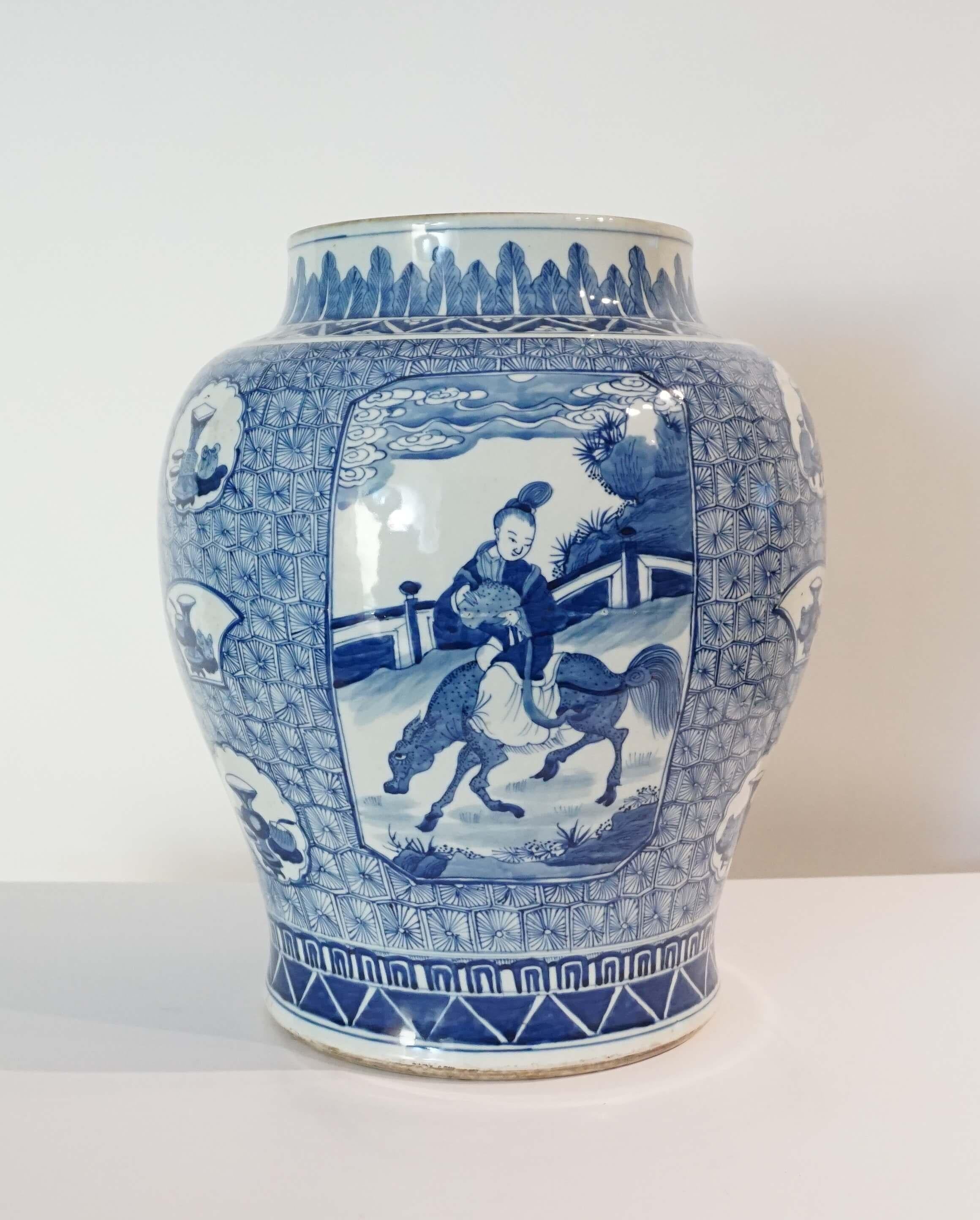 A Chinese Qing dynasty (1644-1912) large broad-shouldered baluster jar vase having all-over underglaze blue figural, foliate, geometric, and panel designs in Kangxi-style now with removable giltwood vase cap French-wired and mounted with solid brass