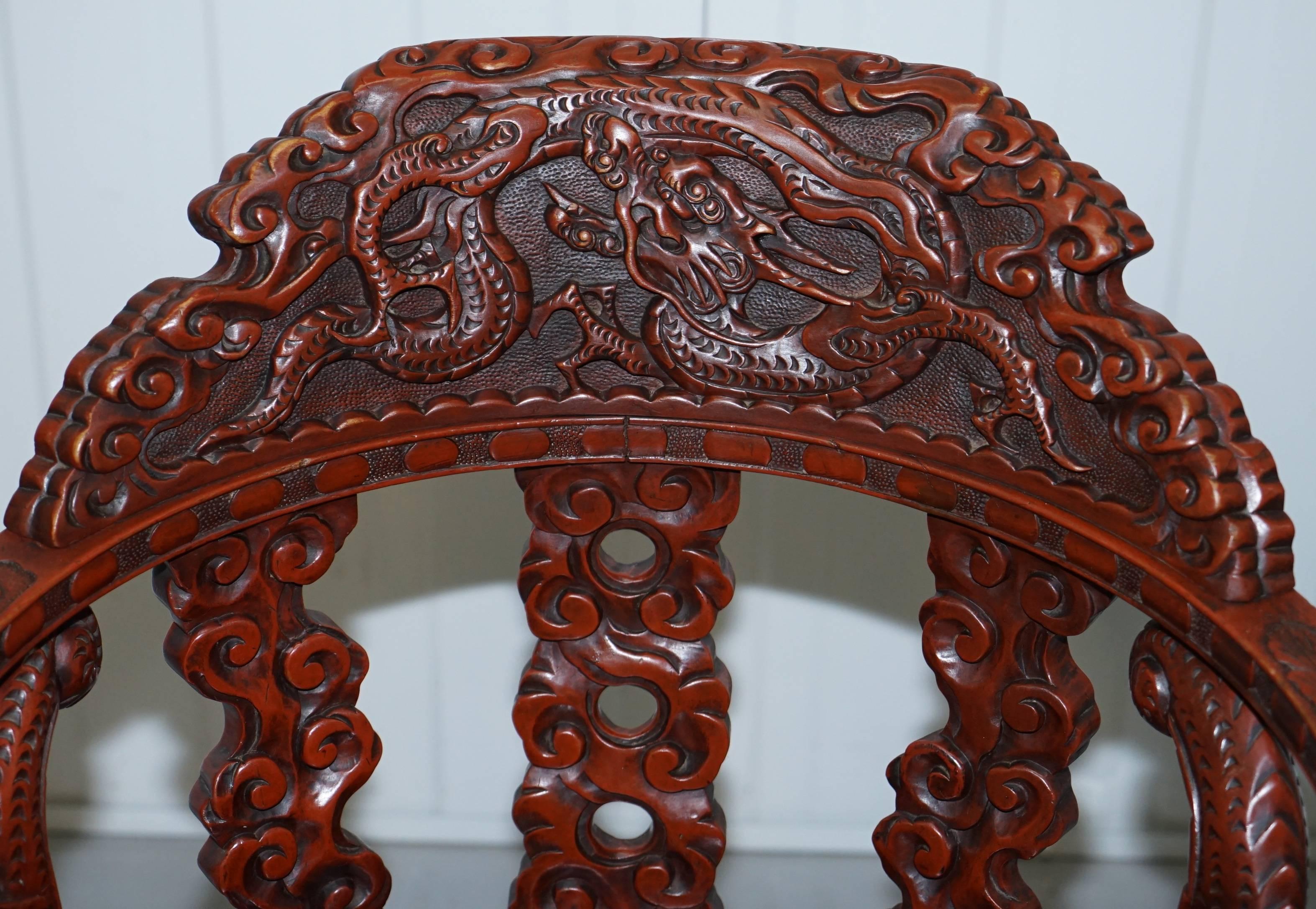 Chinese Export Chinese Qing Dynasty Carved Redwood Dragon and Lion Foo Dogs Armchair circa 1870