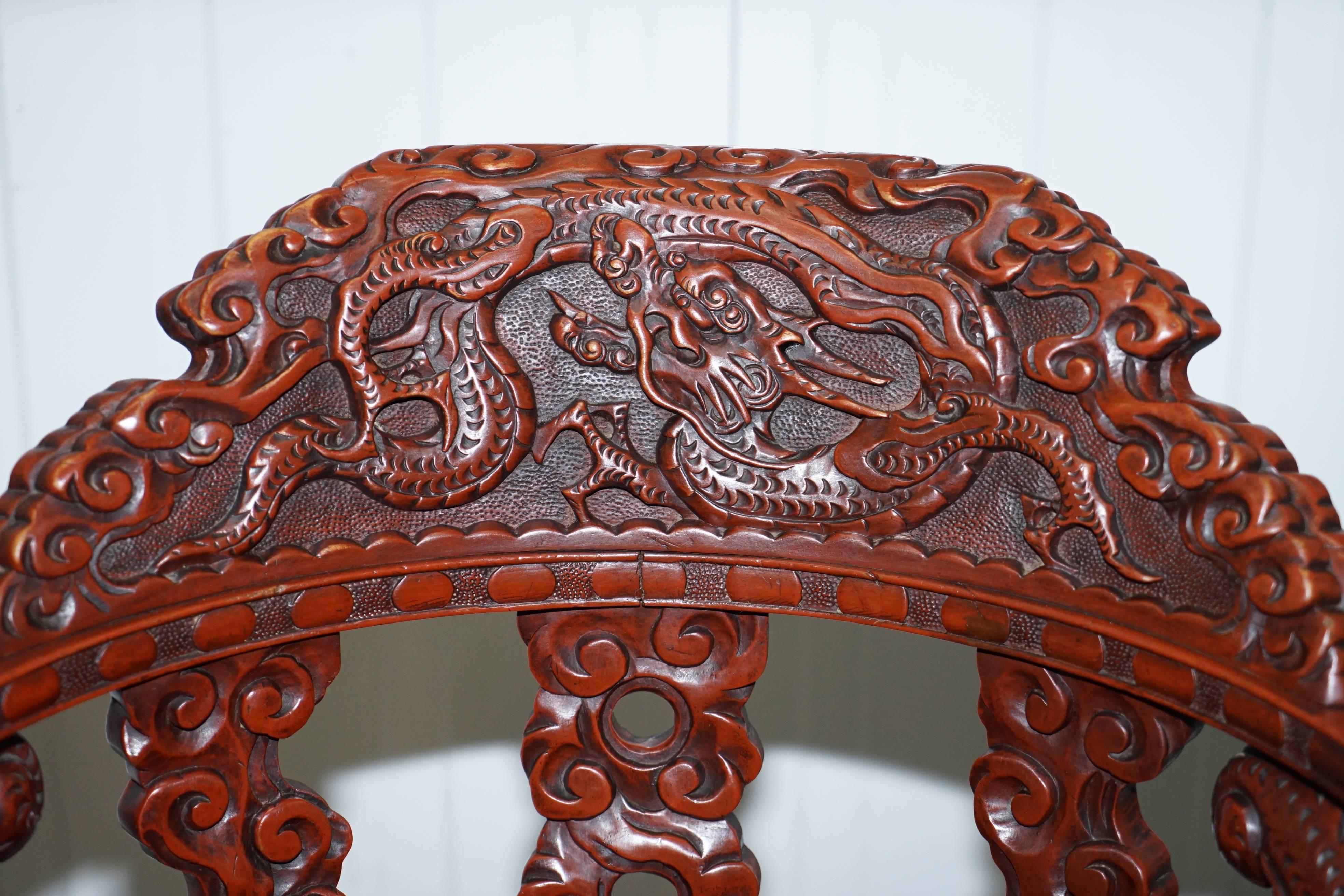 Hand-Carved Chinese Qing Dynasty Carved Redwood Dragon and Lion Foo Dogs Armchair circa 1870