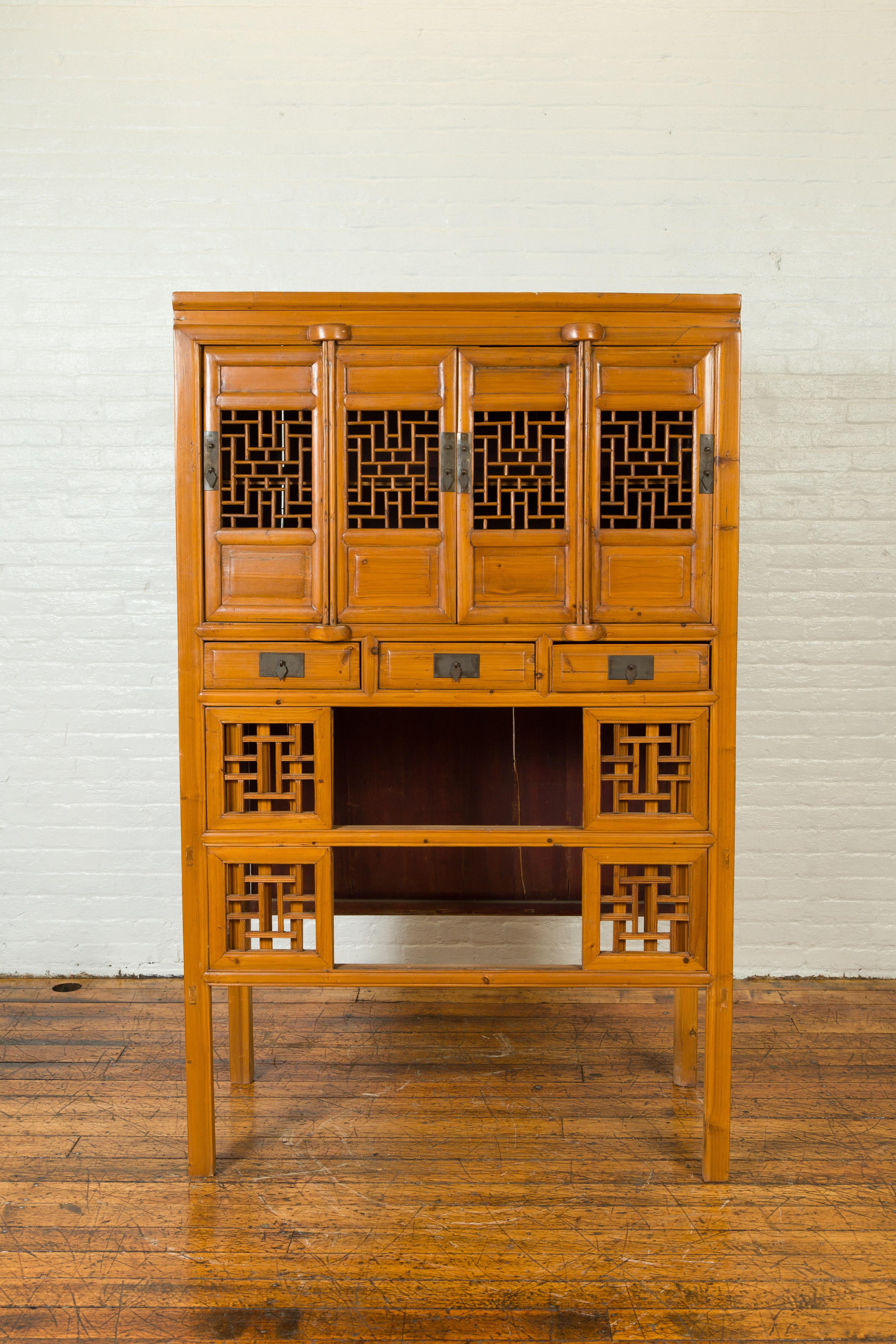 Chinese Qing Dynasty Elm Cabinet with Fretwork Motifs, Doors and Sliding Panels In Good Condition In Yonkers, NY