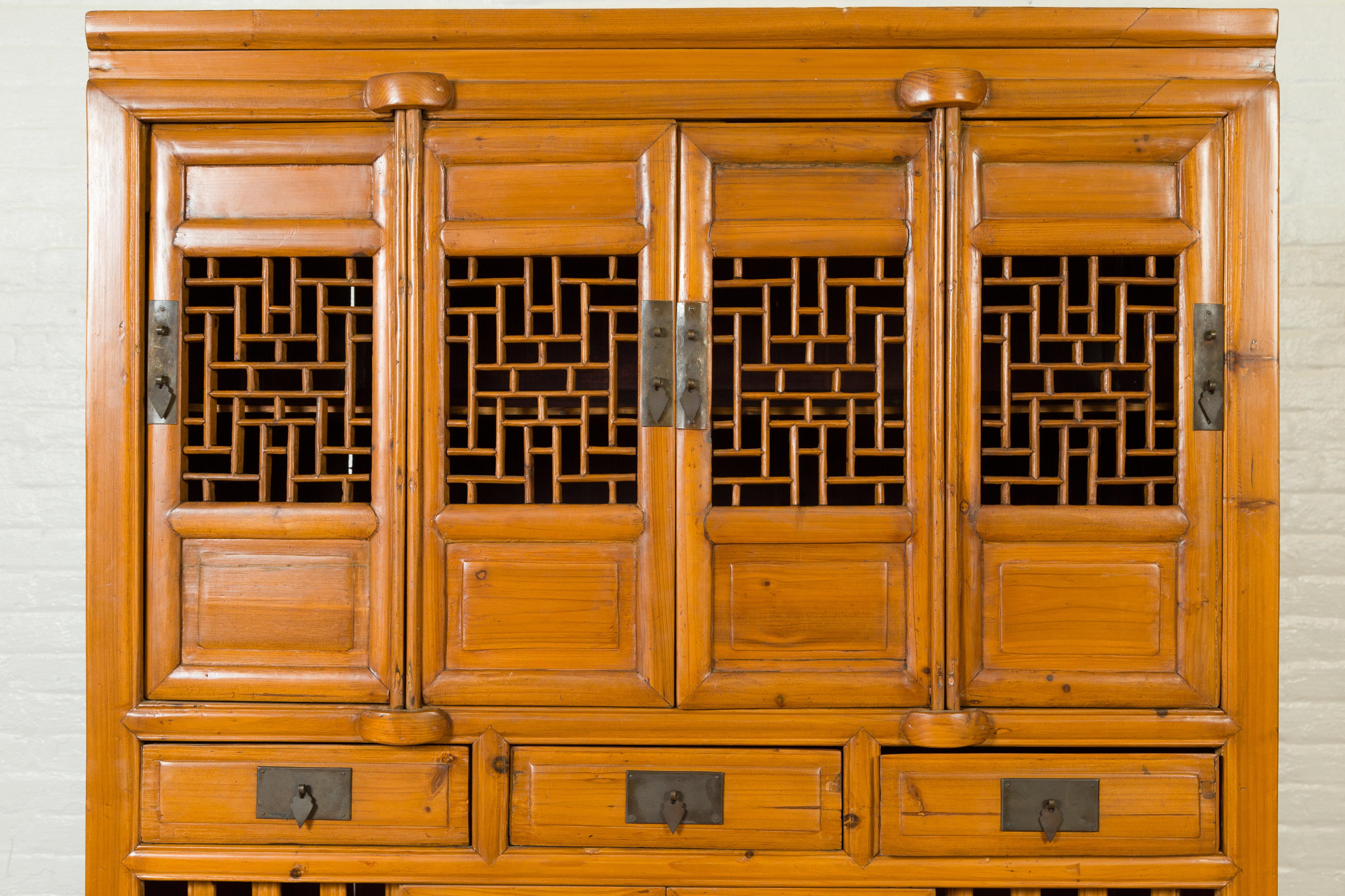 Chinese Qing Dynasty Elm Cabinet with Fretwork Motifs, Doors and Sliding Panels 2