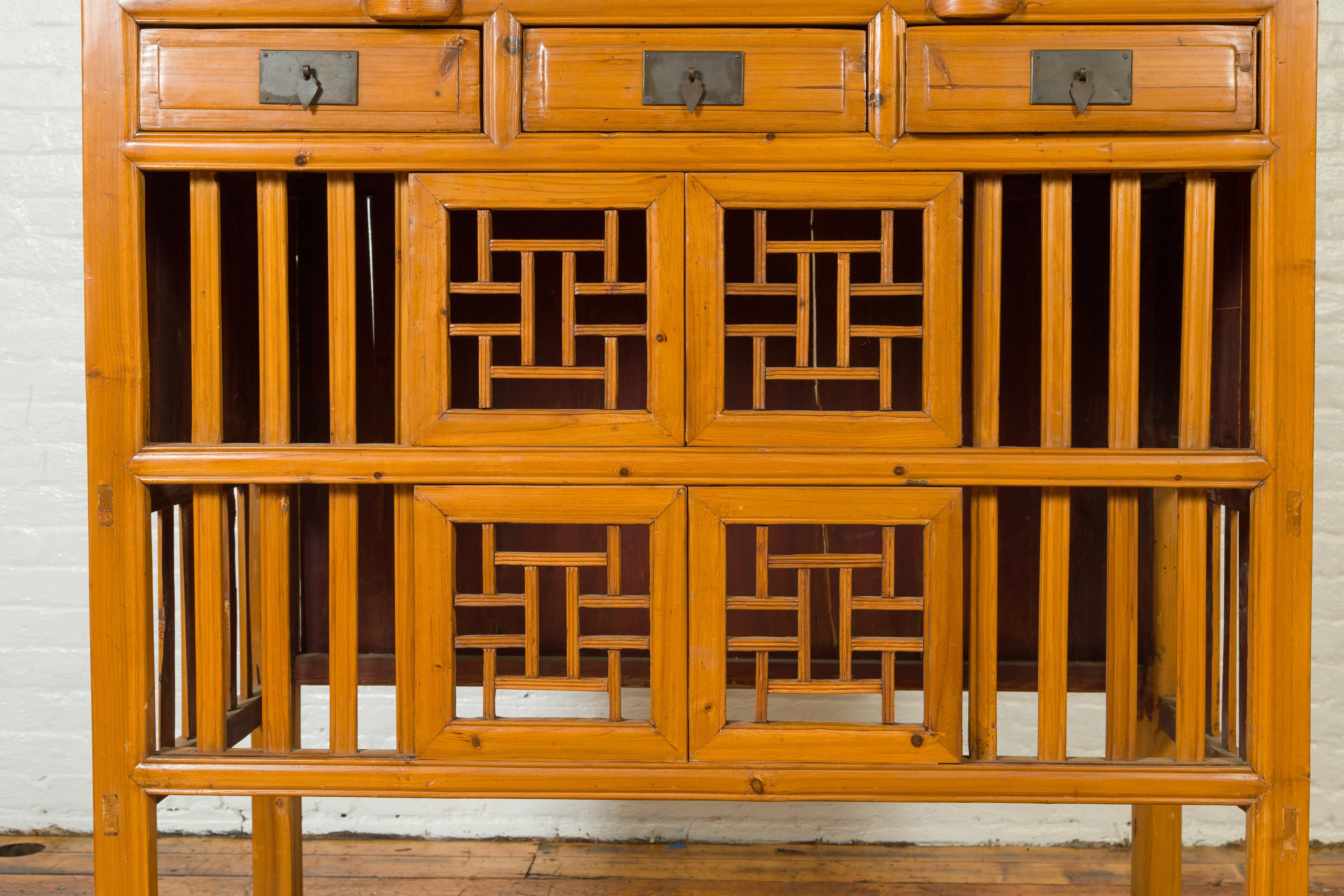 Chinese Qing Dynasty Elm Cabinet with Fretwork Motifs, Doors and Sliding Panels 3