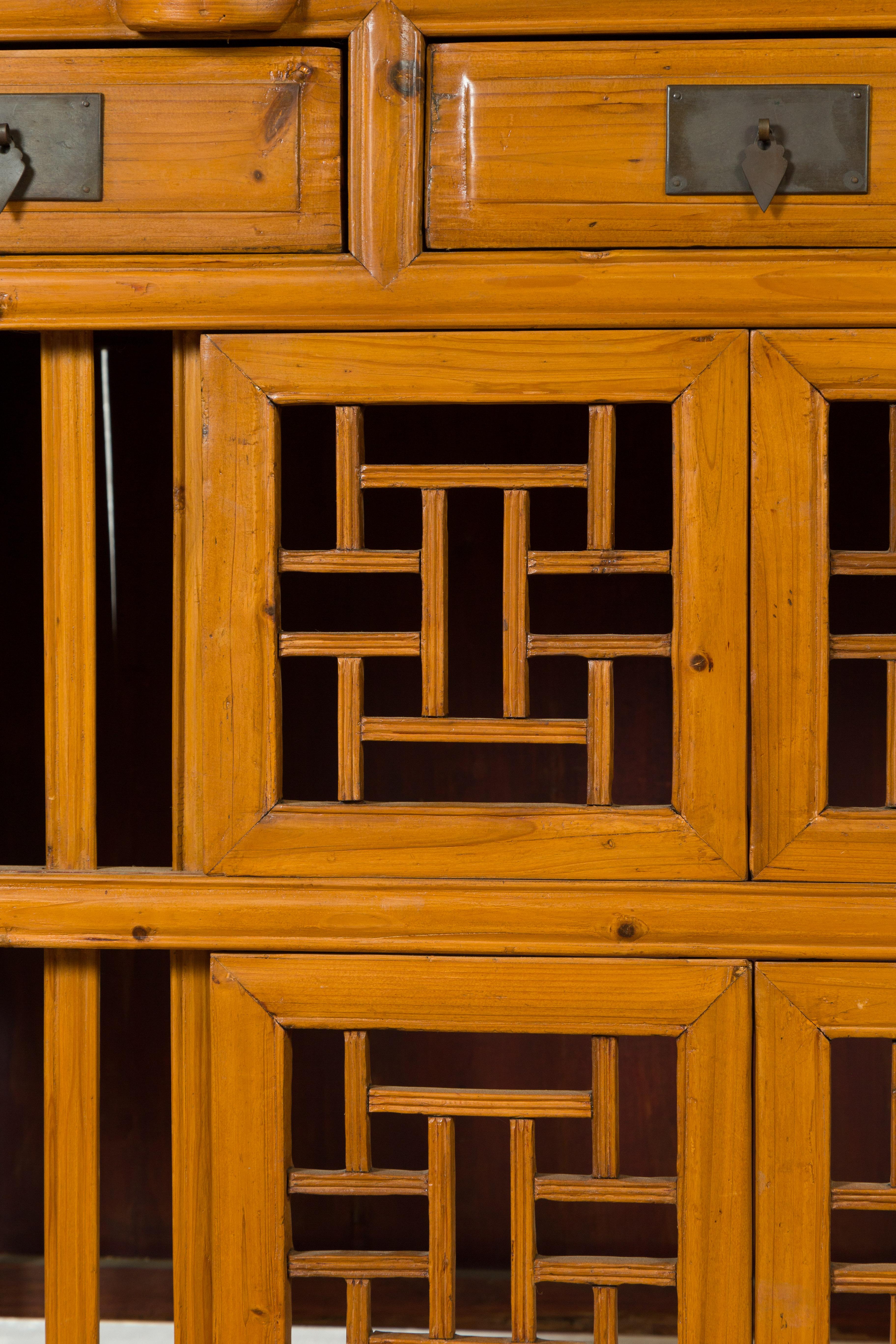 Chinese Qing Dynasty Elm Cabinet with Fretwork Motifs, Doors and Sliding Panels 4