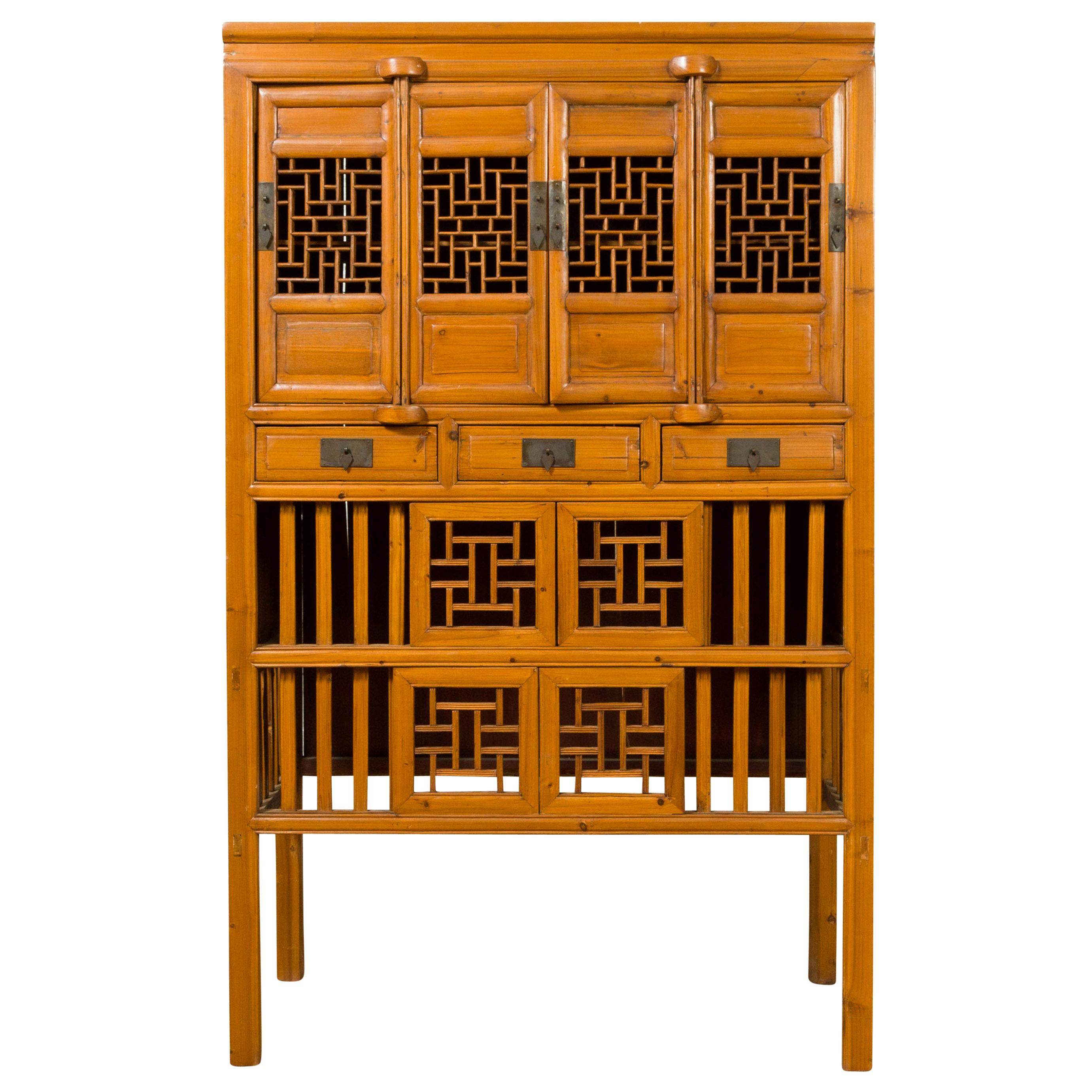 Chinese Qing Dynasty Elm Cabinet with Fretwork Motifs, Doors and Sliding Panels