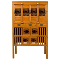 Chinese Qing Dynasty Elm Cabinet with Fretwork Motifs, Doors and Sliding Panels