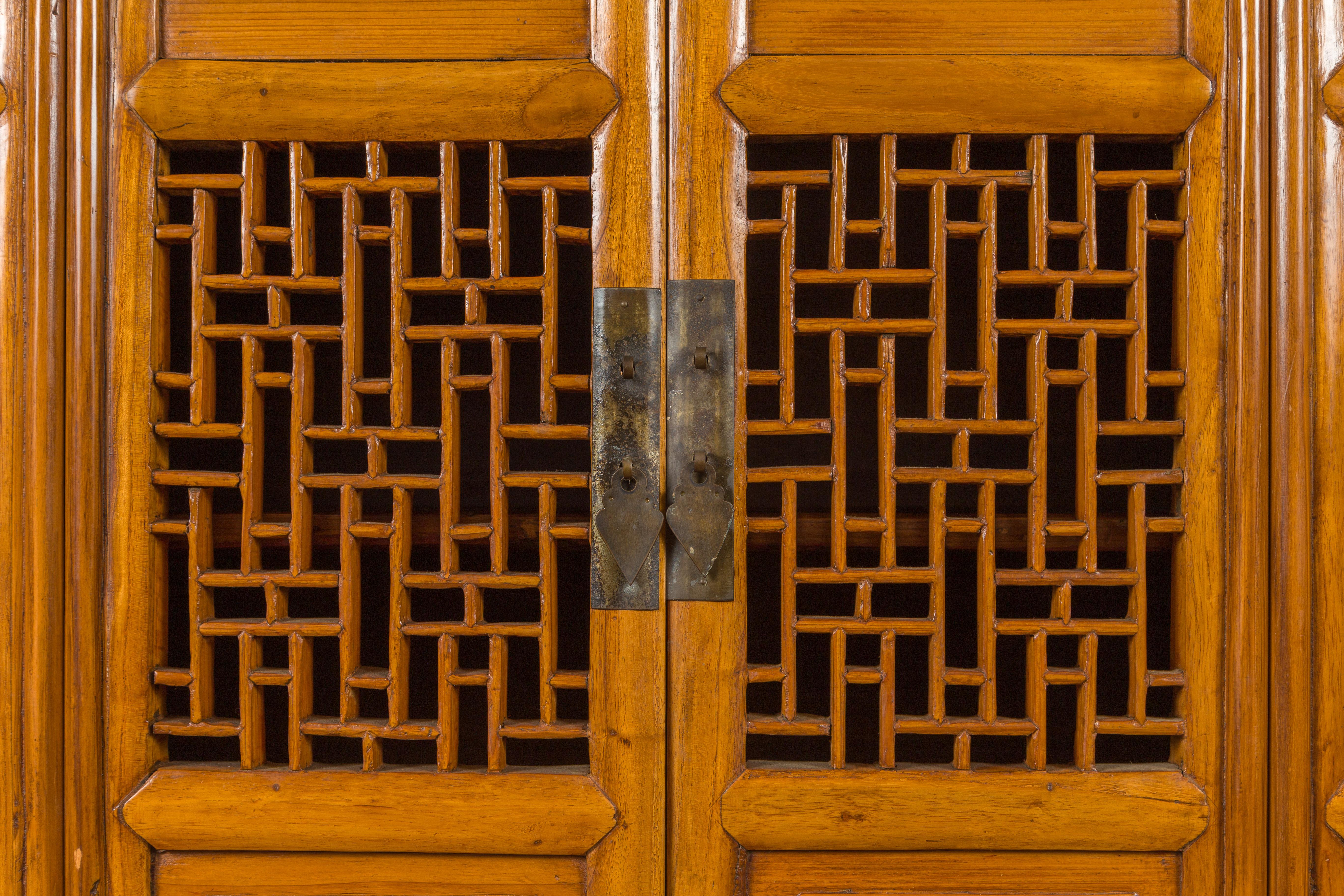 Chinese Qing Dynasty Elm Kitchen Cabinet with Fretwork Motifs and Sliding Panels 6
