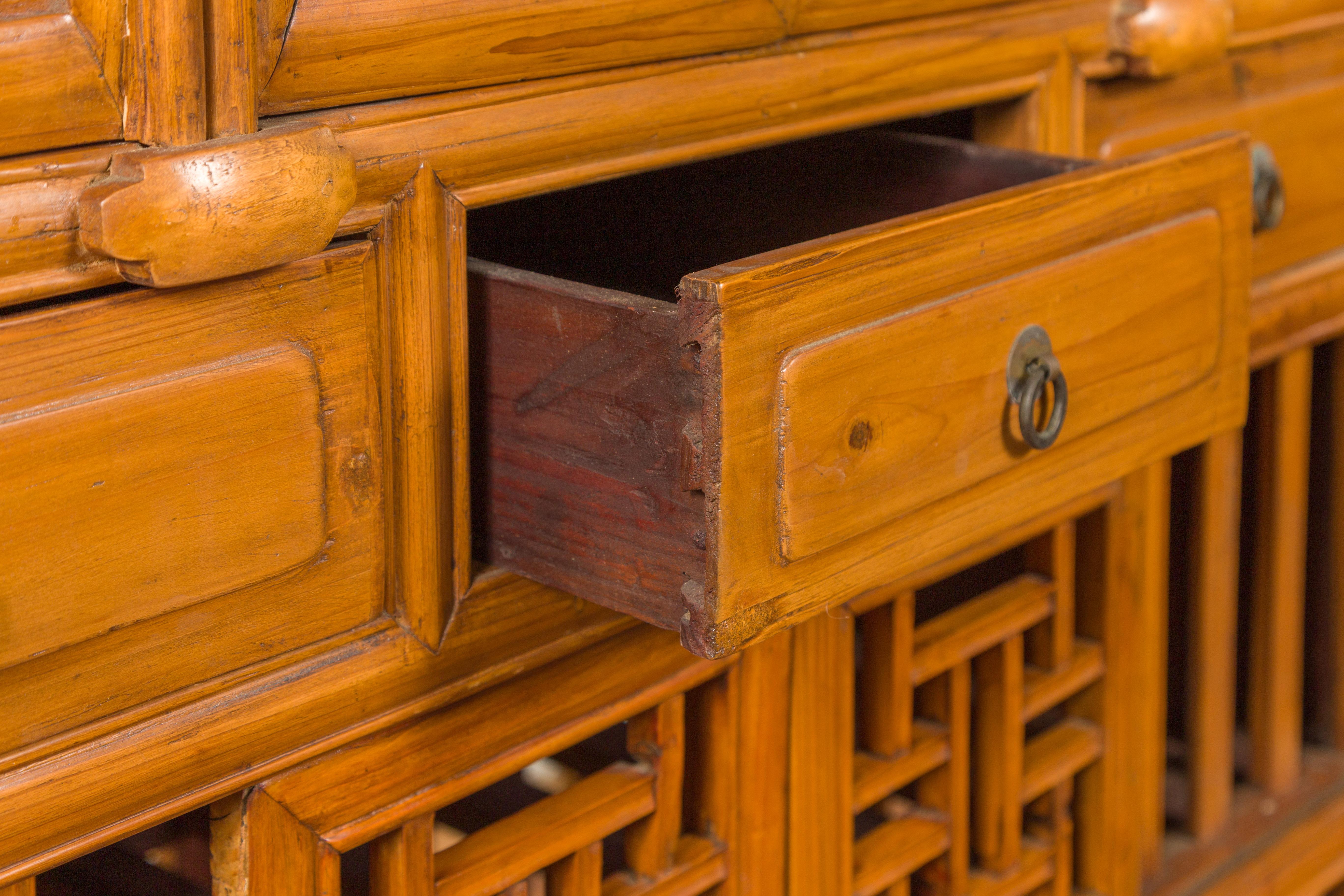 Chinese Qing Dynasty Elm Kitchen Cabinet with Fretwork Motifs and Sliding Panels 7