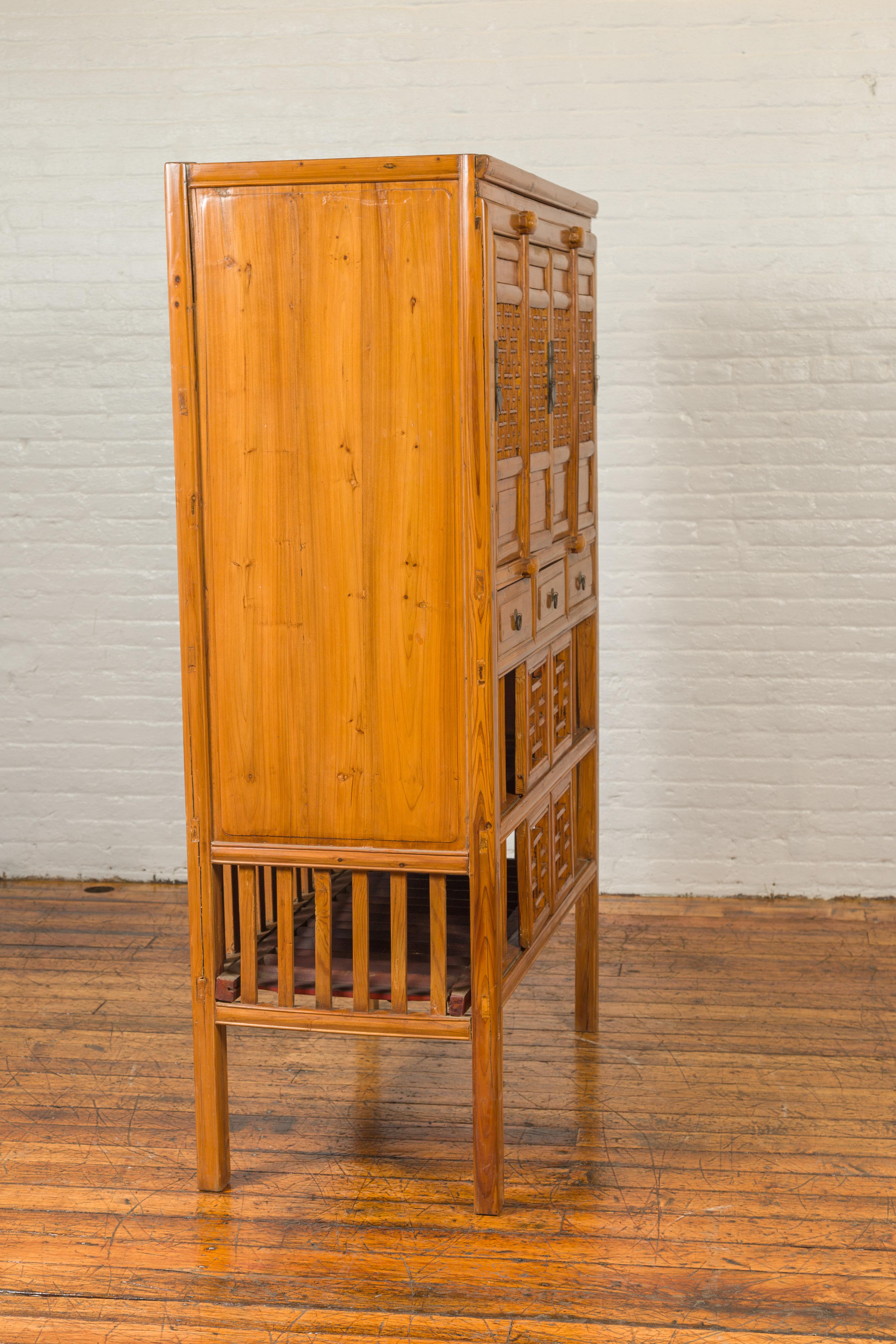 Chinese Qing Dynasty Elm Kitchen Cabinet with Fretwork Motifs and Sliding Panels 8